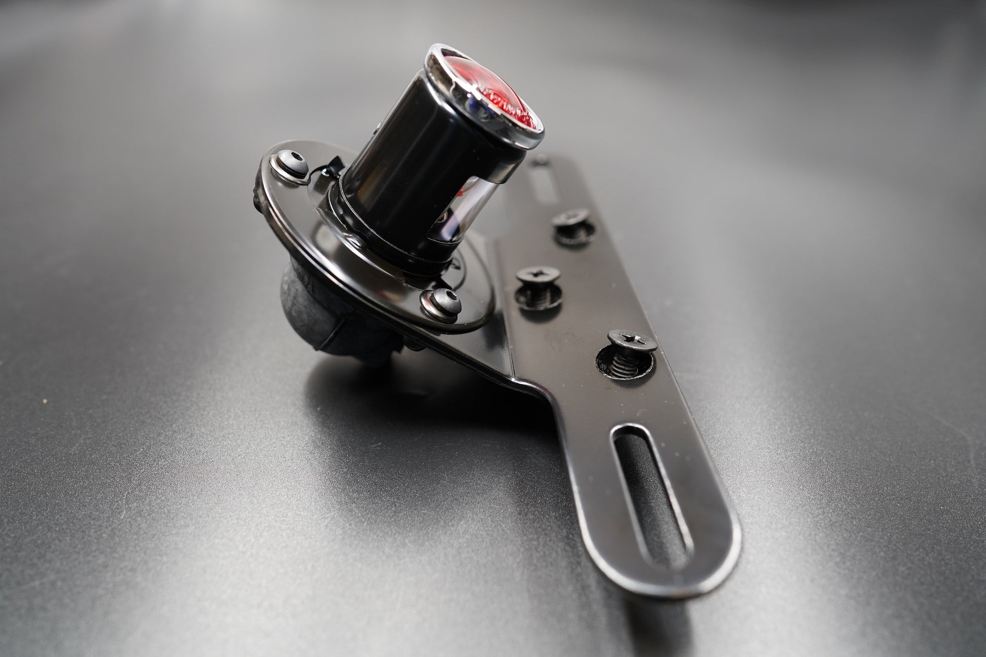 Rear housing view showing matte black coating and bolt mount area.