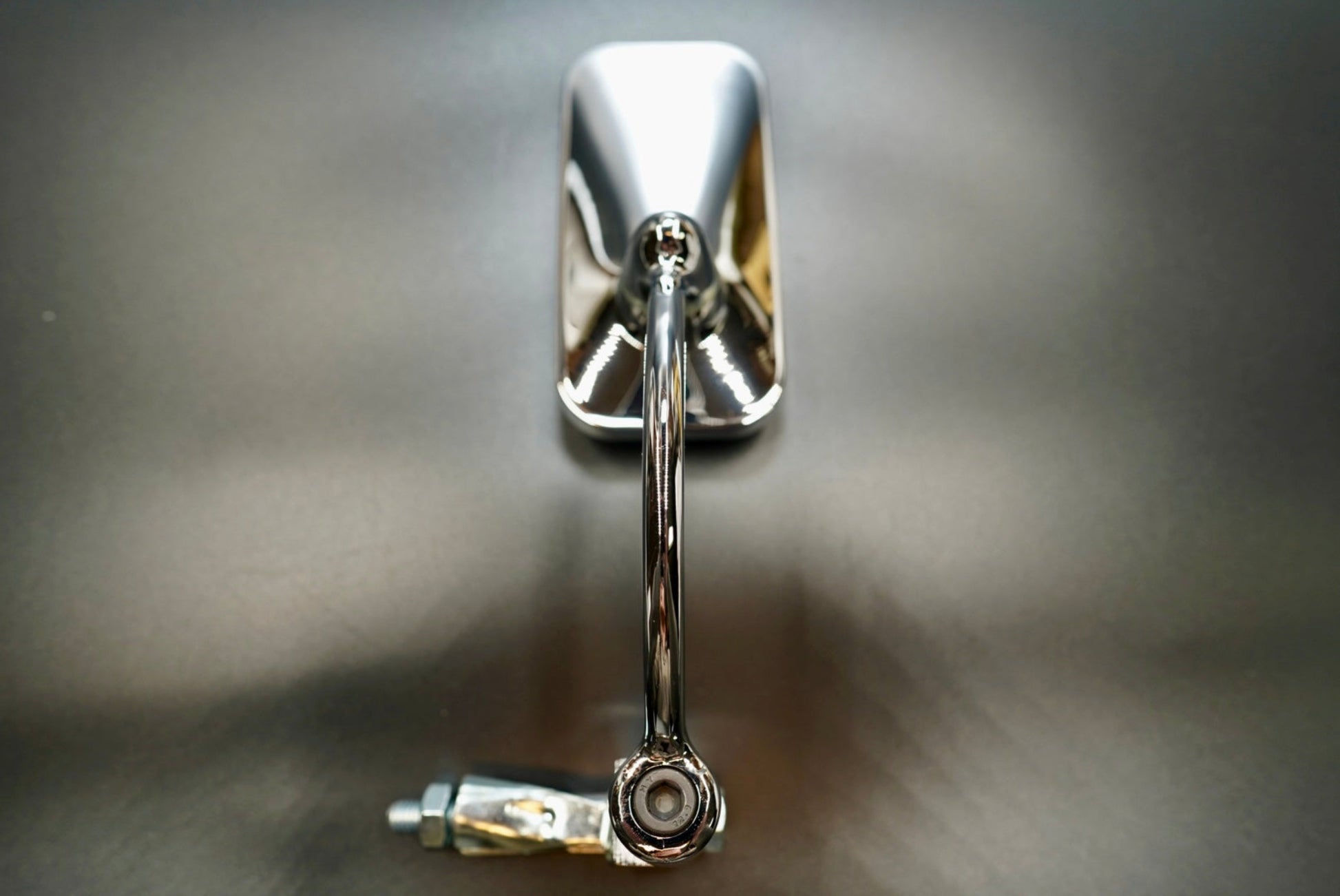 Front view of bar-end rearview mirror — minimalist rectangular design in matte black and polished silver finishes.