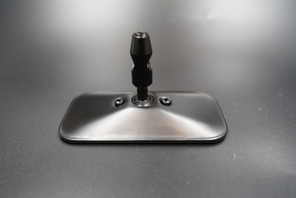 Front view of rectangular vintage rearview mirror — minimalist metal design with matte black and polished silver finishes.