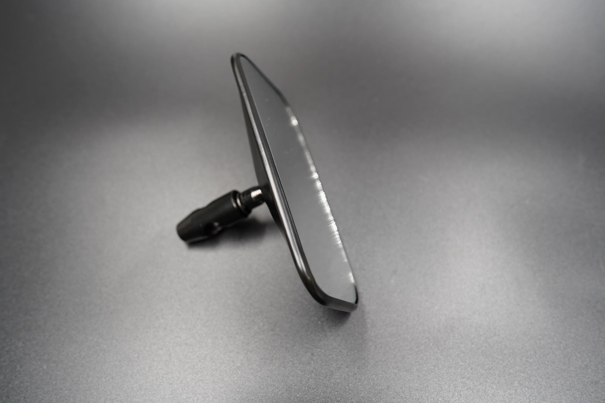 Side profile of the rectangular vintage motorcycle mirror — balanced proportions and sleek polished edge.