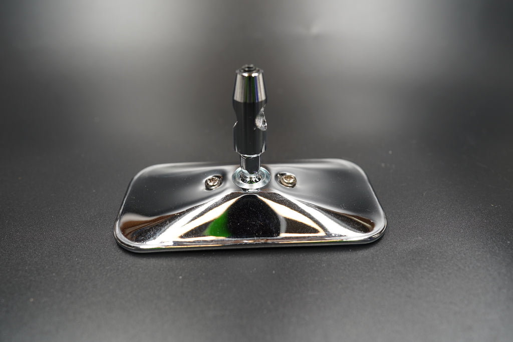 Top angle view showing the slim aluminium stem and rectangular mirror head — crafted for clean symmetry.