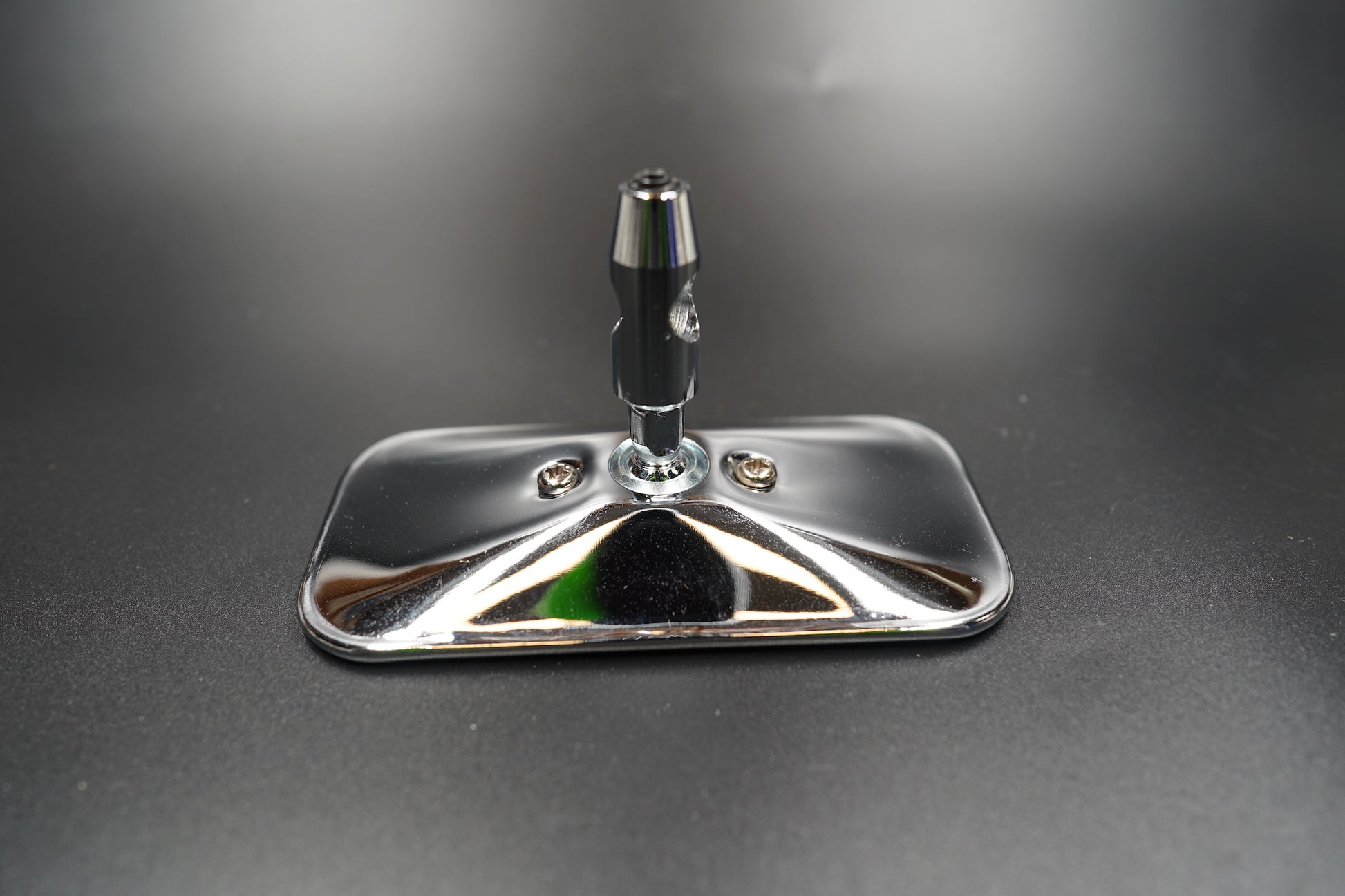 Top angle view showing the slim aluminium stem and rectangular mirror head — crafted for clean symmetry.