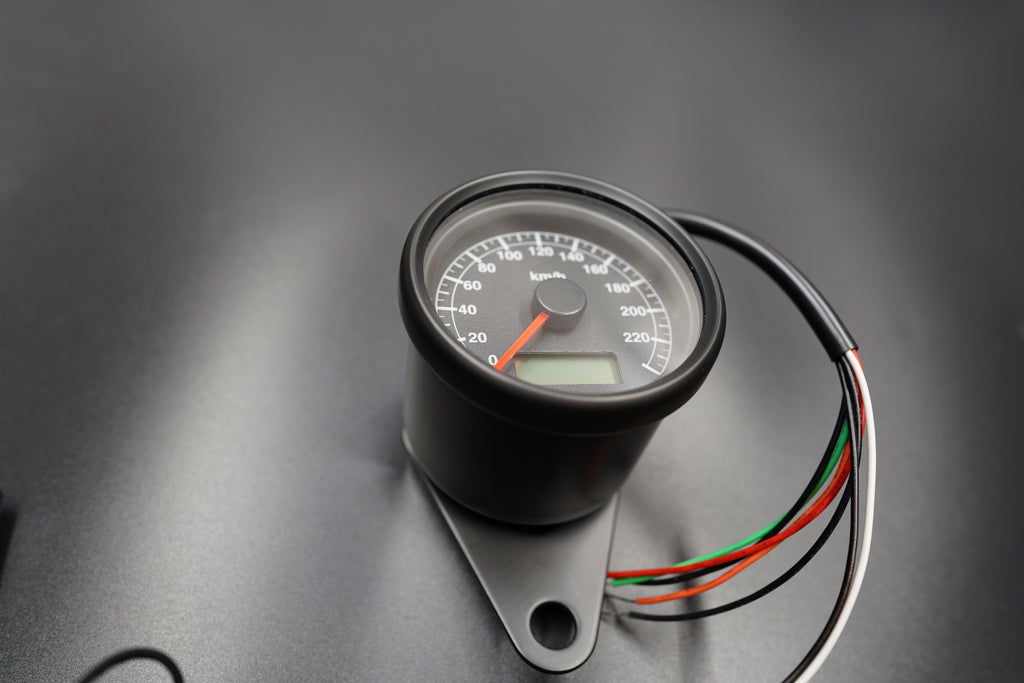 Close-up of electrical connector and sensor wiring for electronic setup.