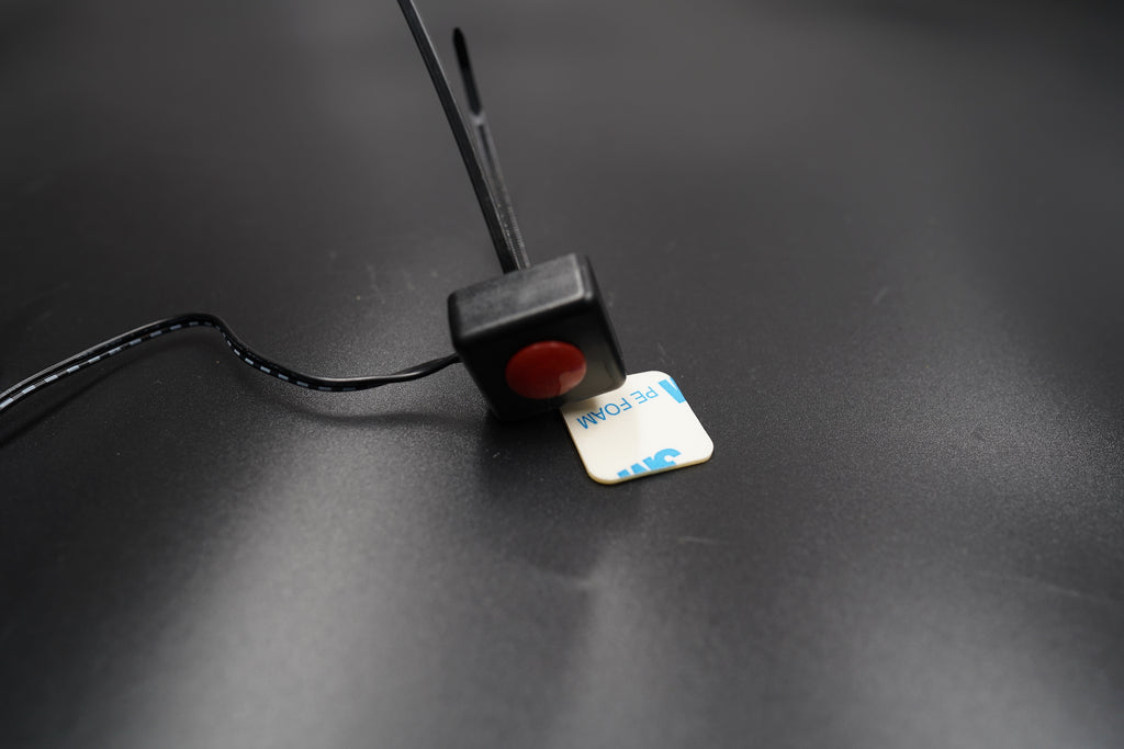 Flat lay of full kit with speedometer and wire harness on matte background.