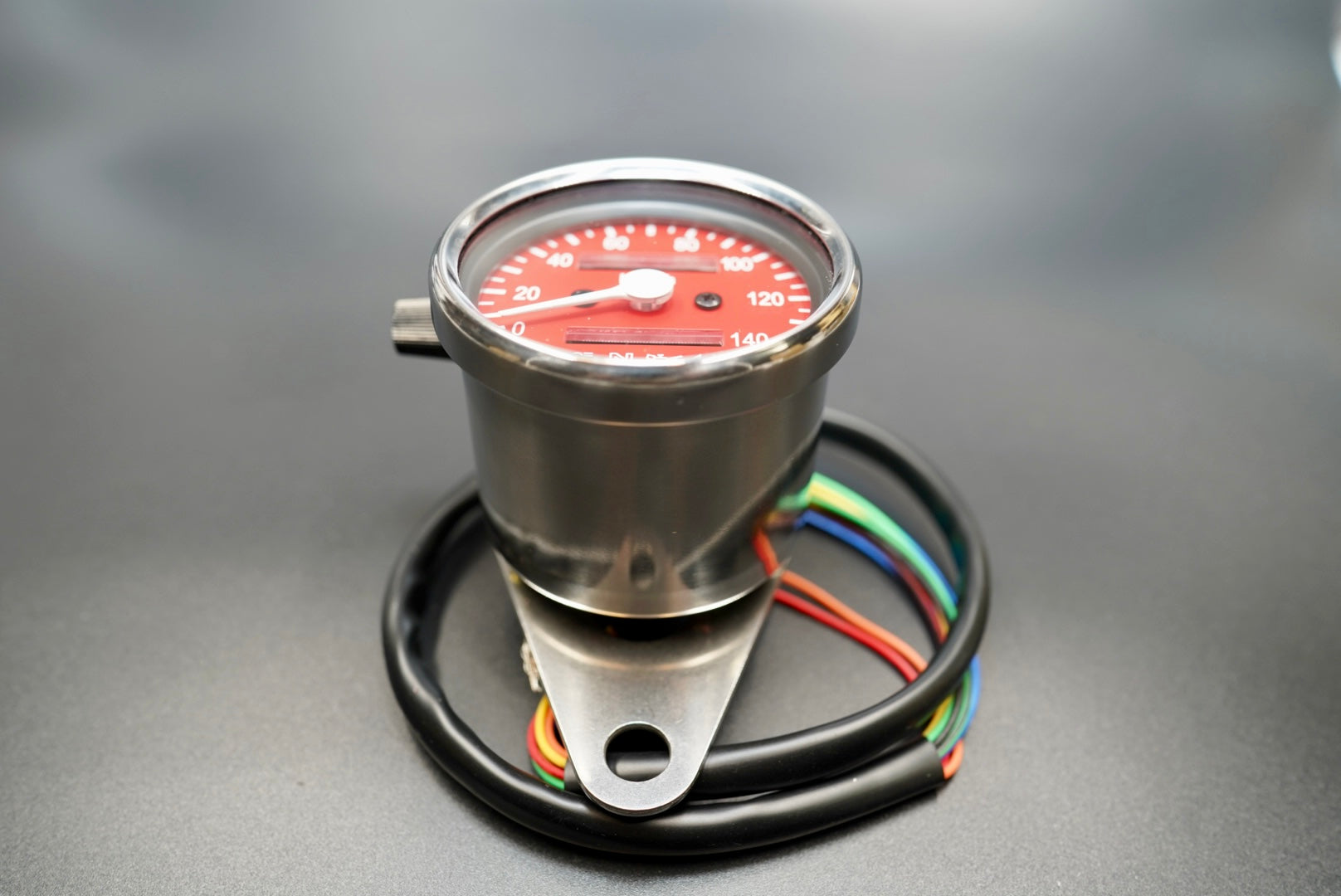 Rear view showing wiring leads and mounting bracket design.