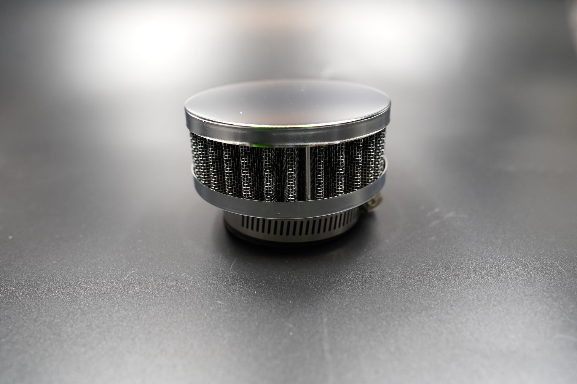 Retro chrome motorcycle air filter front view showing polished dome cap and steel mesh body