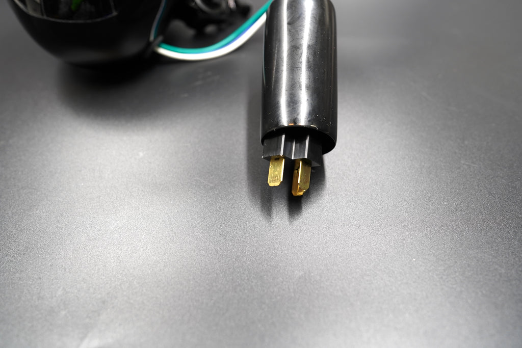 Rear view showing clean housing curvature and wiring exit.