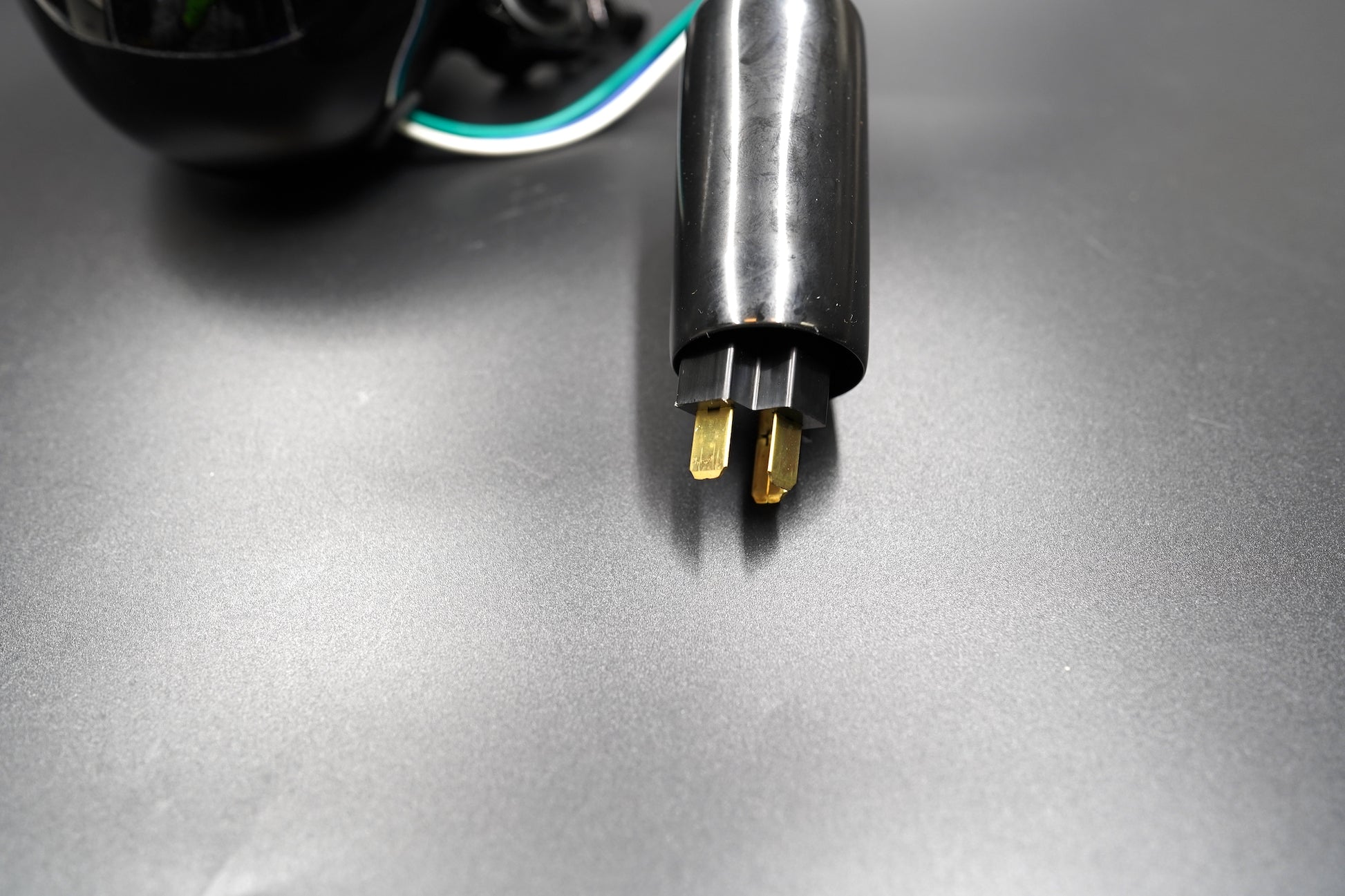 Rear view showing clean housing curvature and wiring exit.