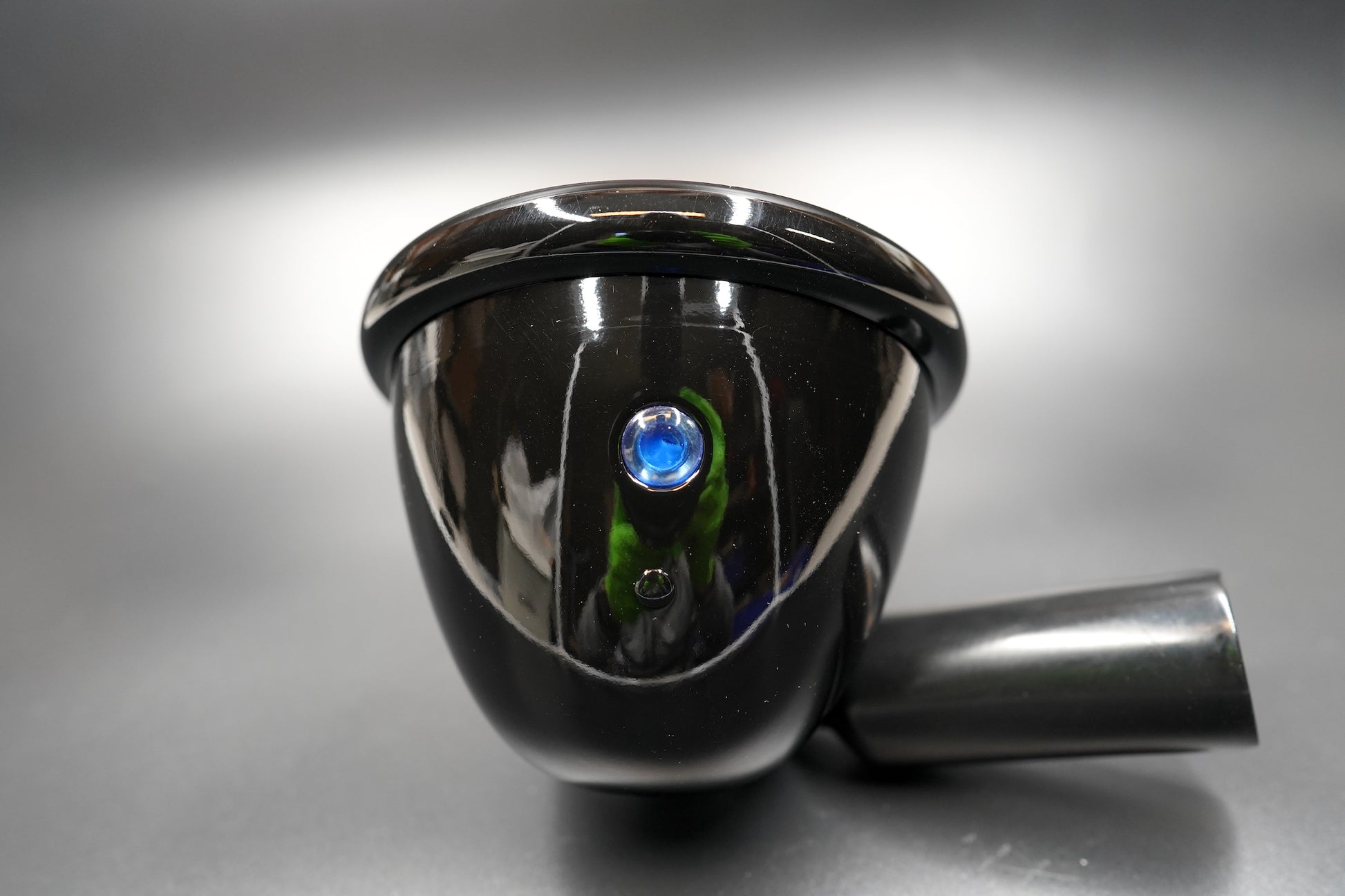 Side profile showing matte black body and bottom mounting bolt design.