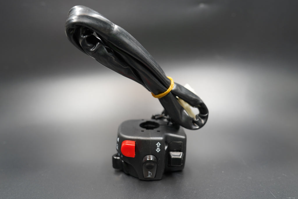 Flat lay of both switch units arranged side by side on grey surface.