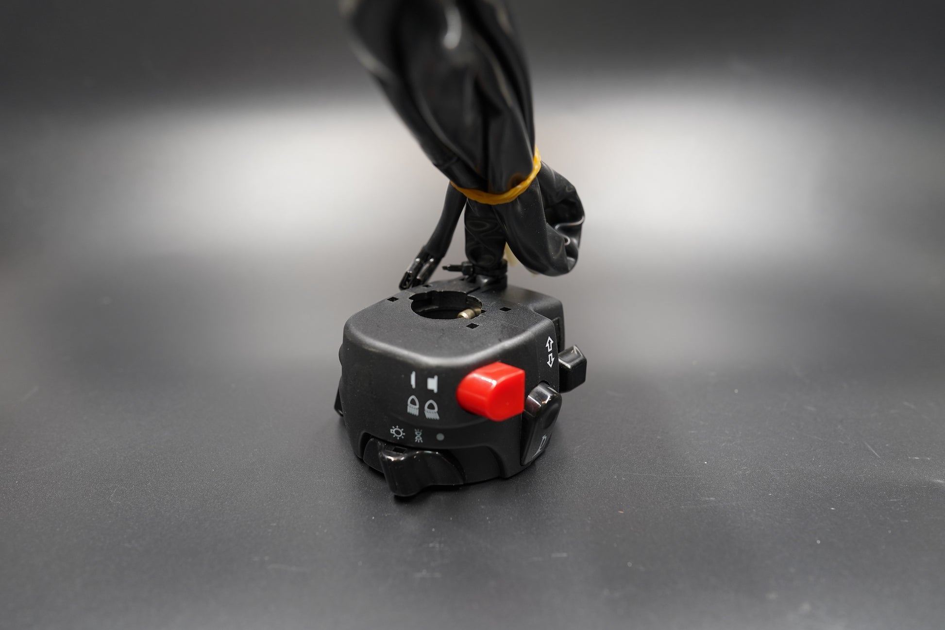 Top-down angle displaying red button and layout of switch positions.