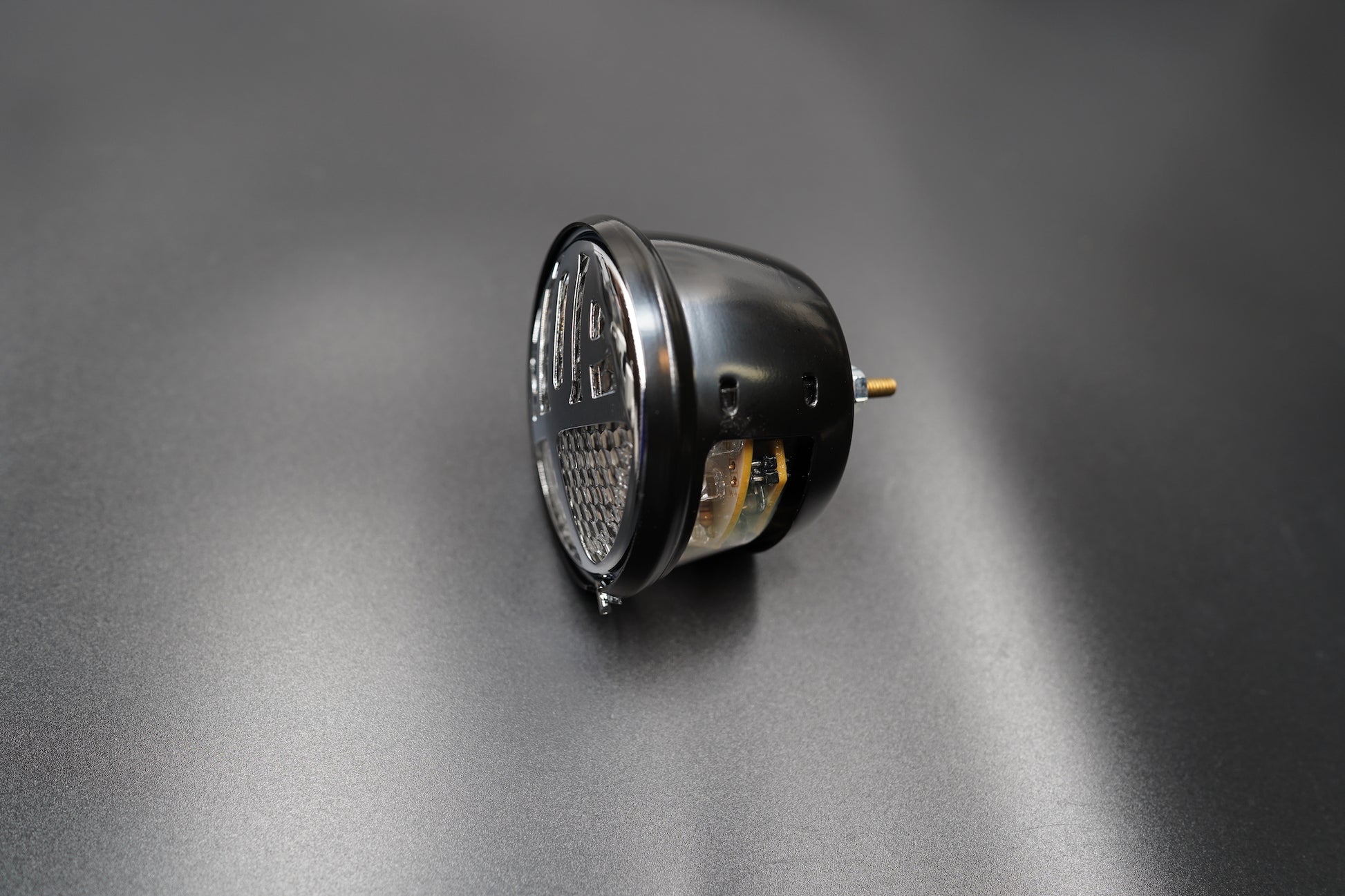 Bottom view focusing on bracket screws and mounting slots.