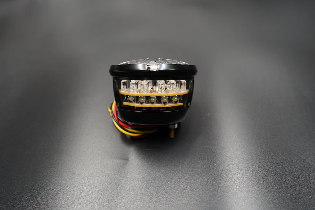 Flat lay composition with light, bracket, and wire neatly arranged.