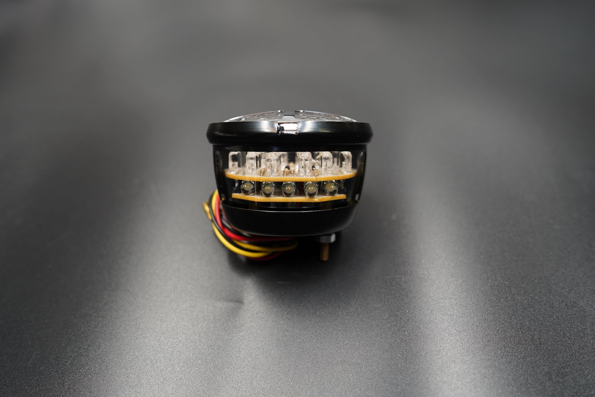 Flat lay composition with light, bracket, and wire neatly arranged.