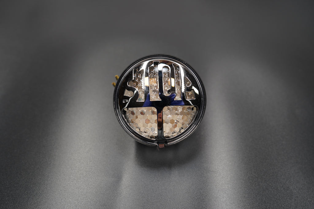 LED illumination close-up under smoked lens.