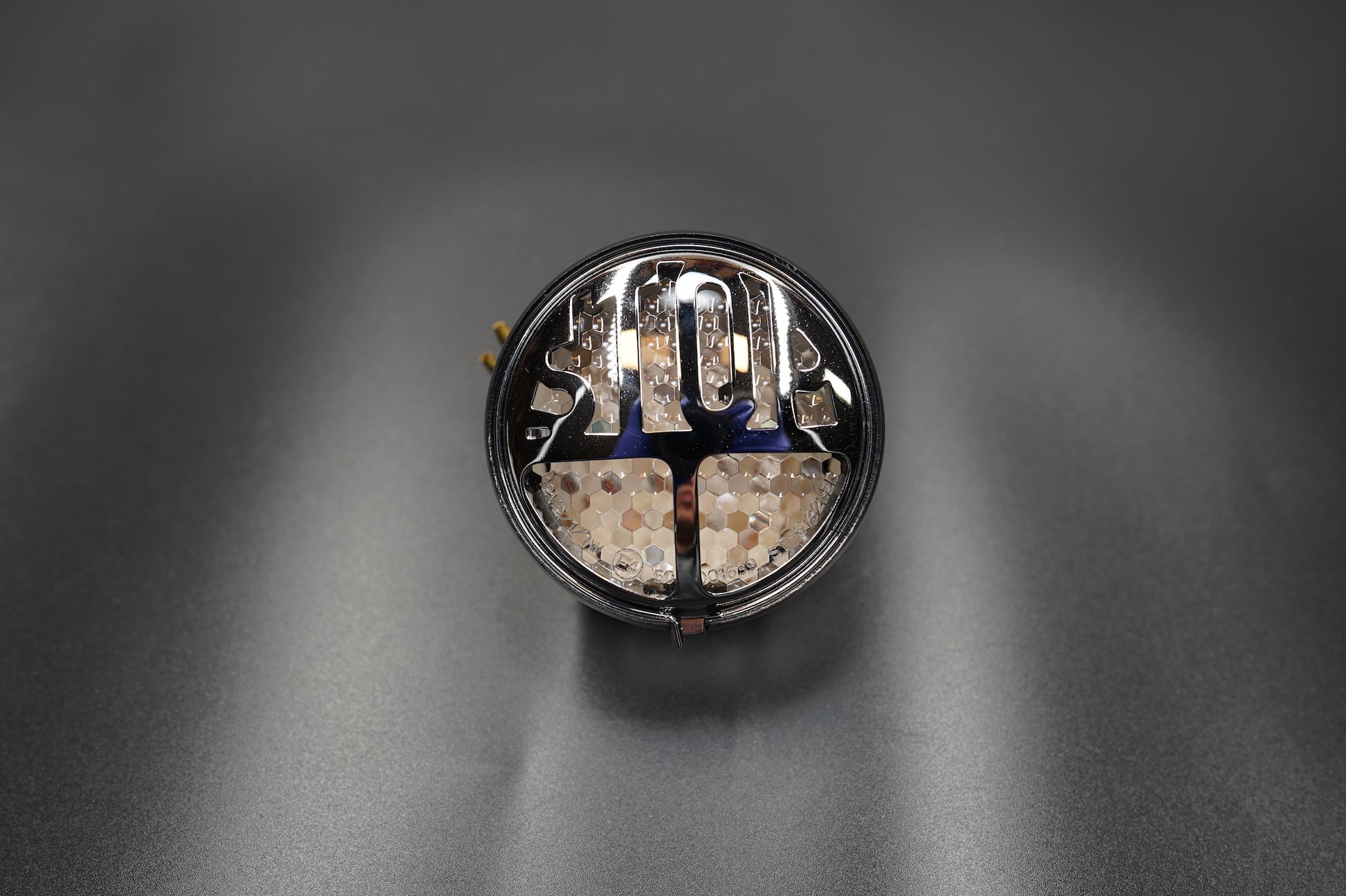 LED illumination close-up under smoked lens.