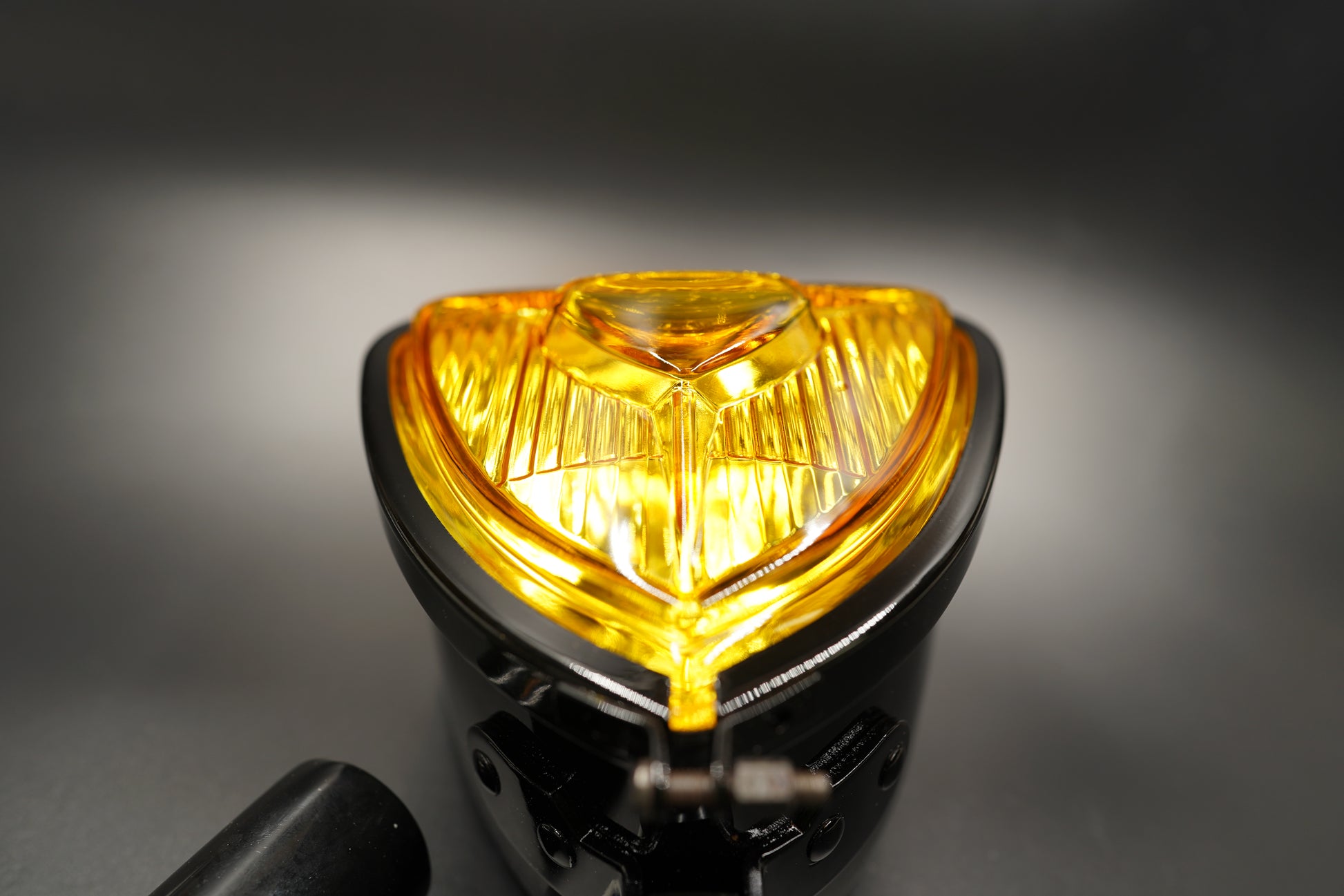 Detail of amber glass surface showing texture and craftsmanship.