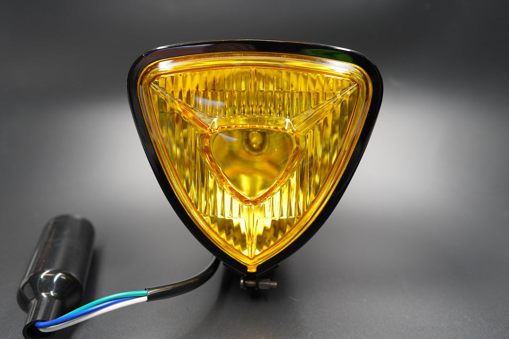 Amber lens version front angle showing warm golden tone and chrome edge.