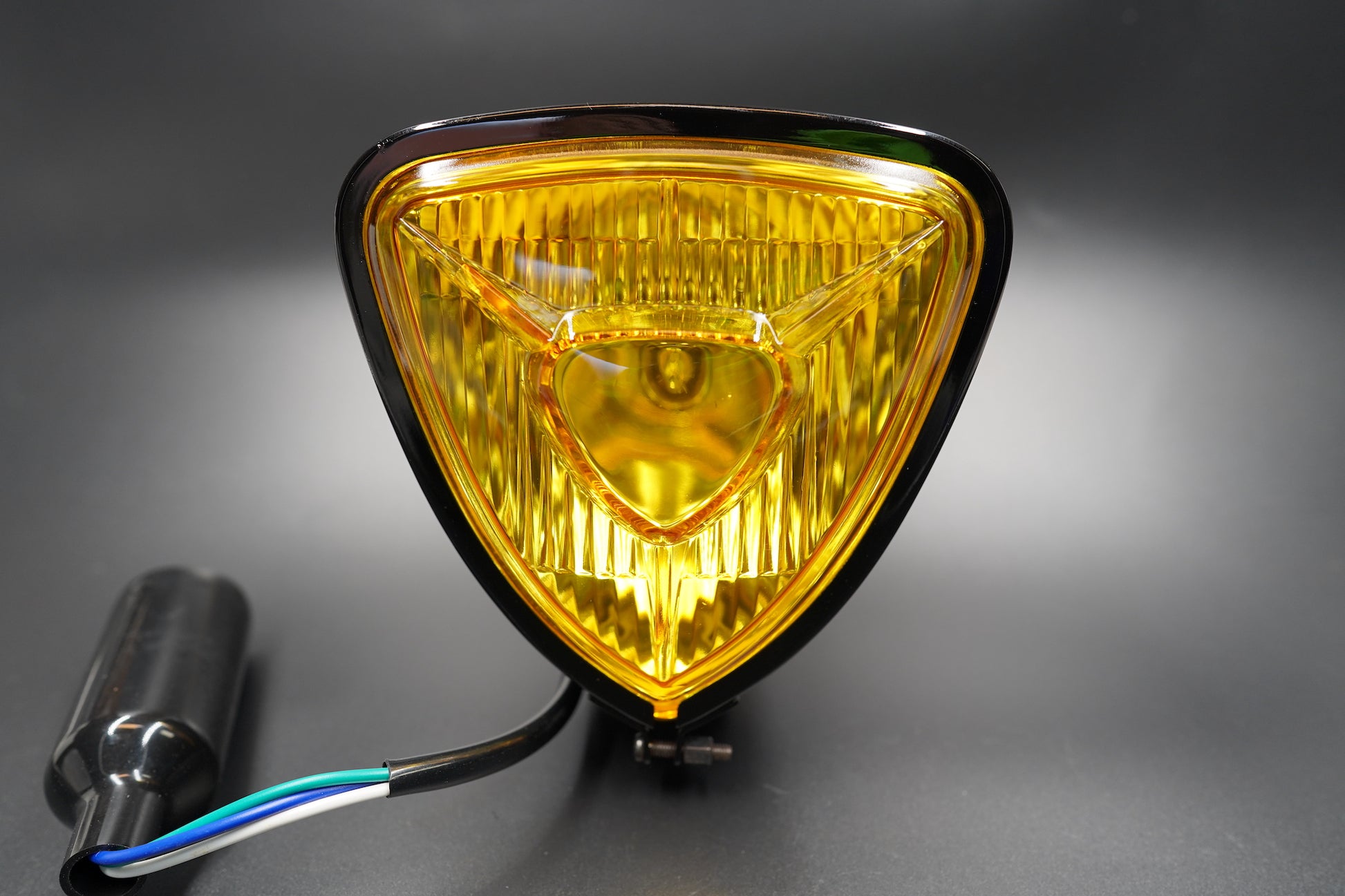 Amber lens version front angle showing warm golden tone and chrome edge.