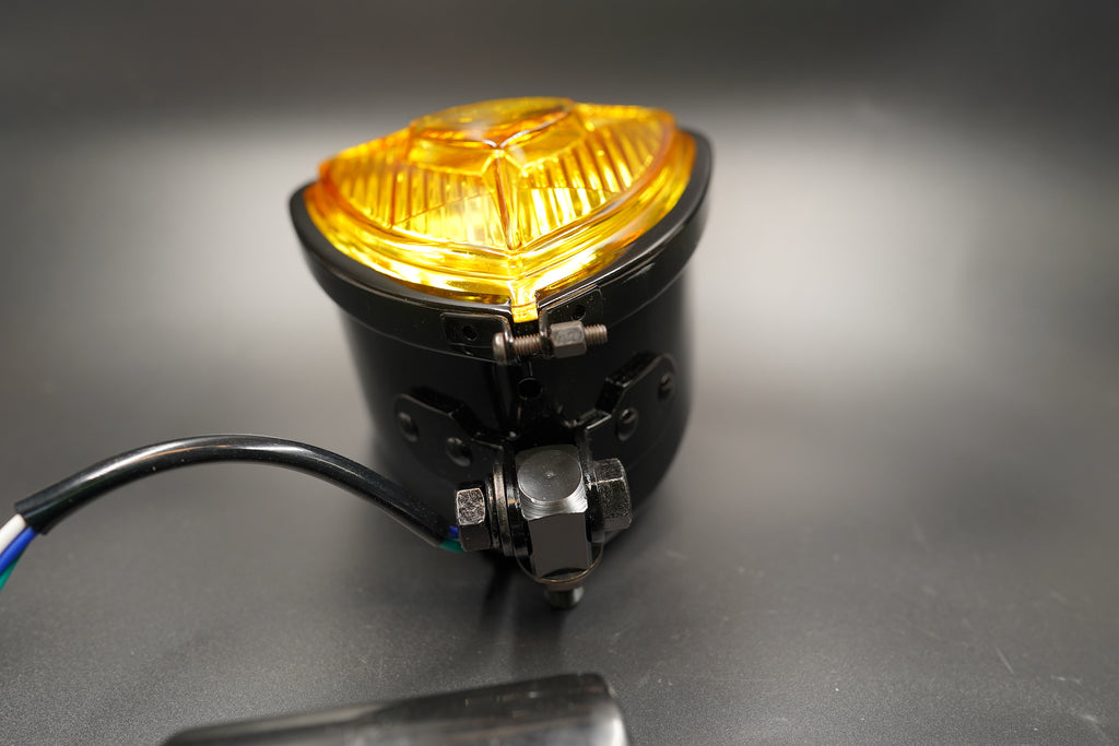 Front glowing amber view showing warm hue and internal light pattern.