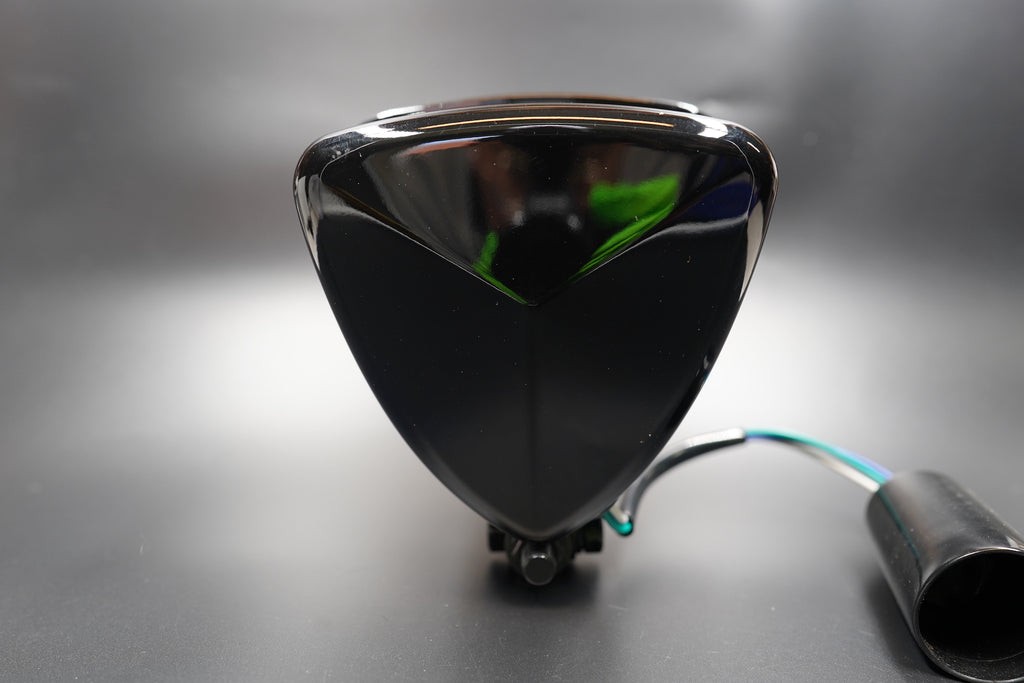 Rear housing view with wiring output and smooth curvature.