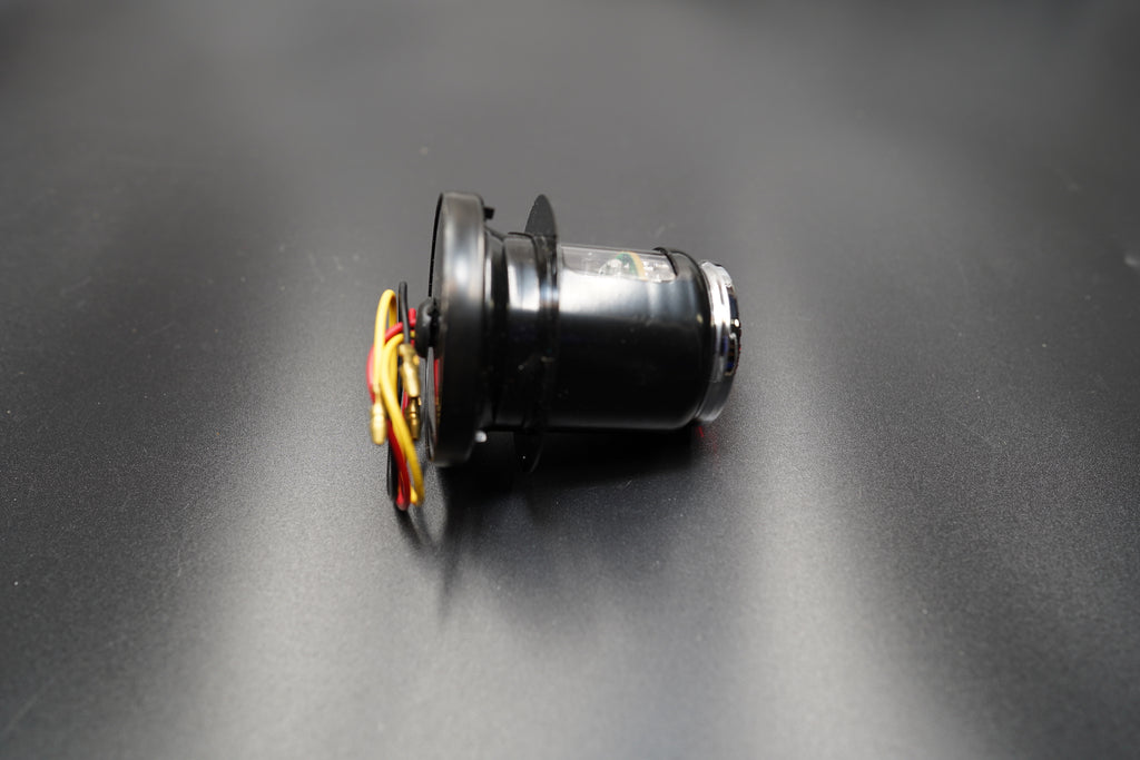 Rear housing angle showing clean metal finish and wire entry point.