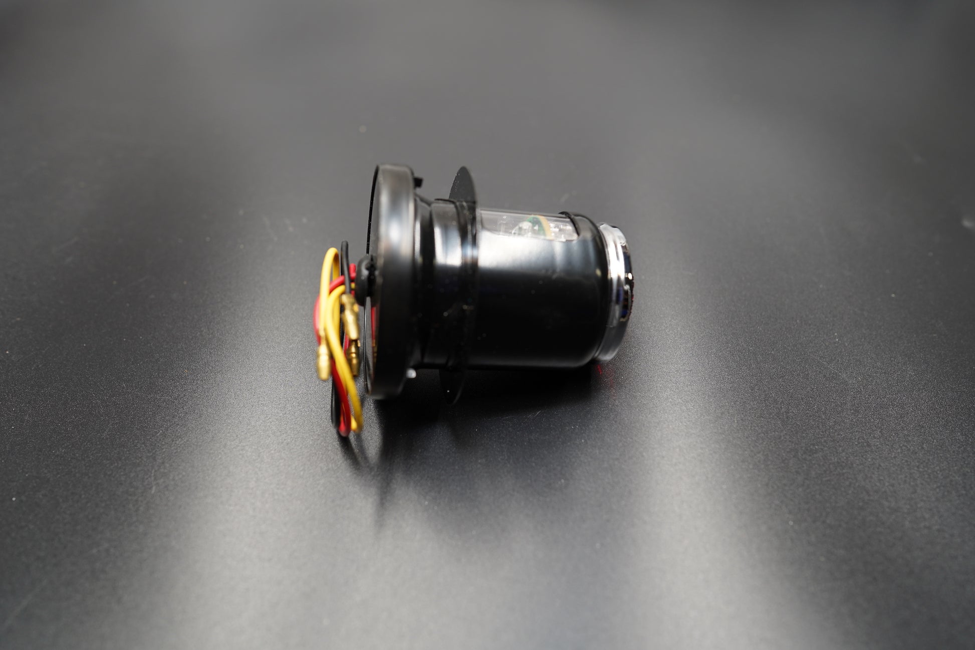 Rear housing angle showing clean metal finish and wire entry point.