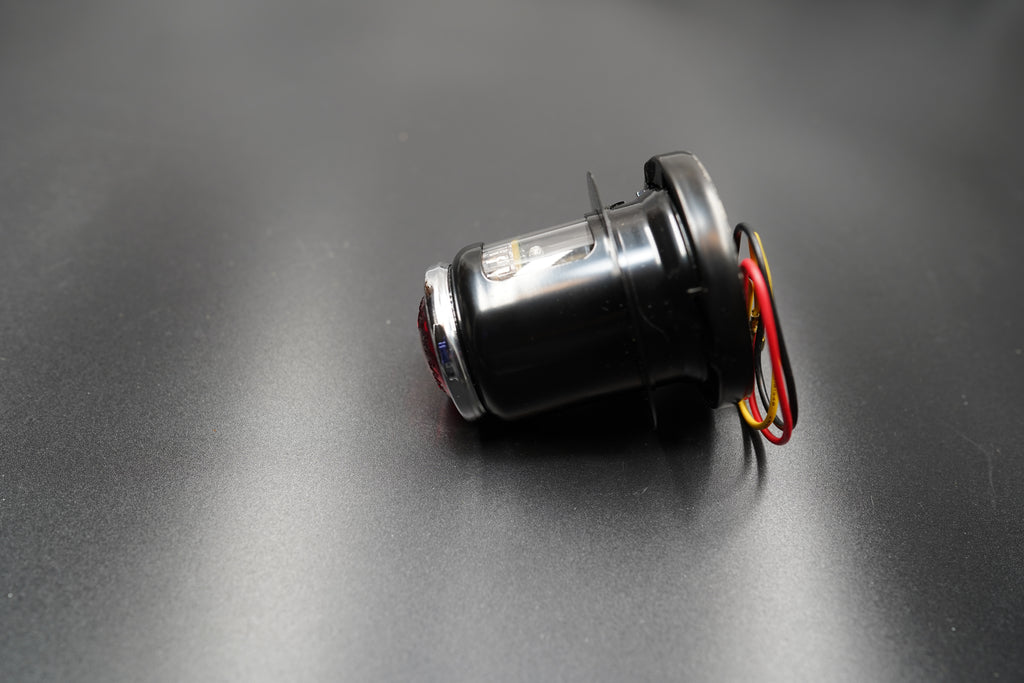 Left side angle showing compact design and 12V wiring layout.