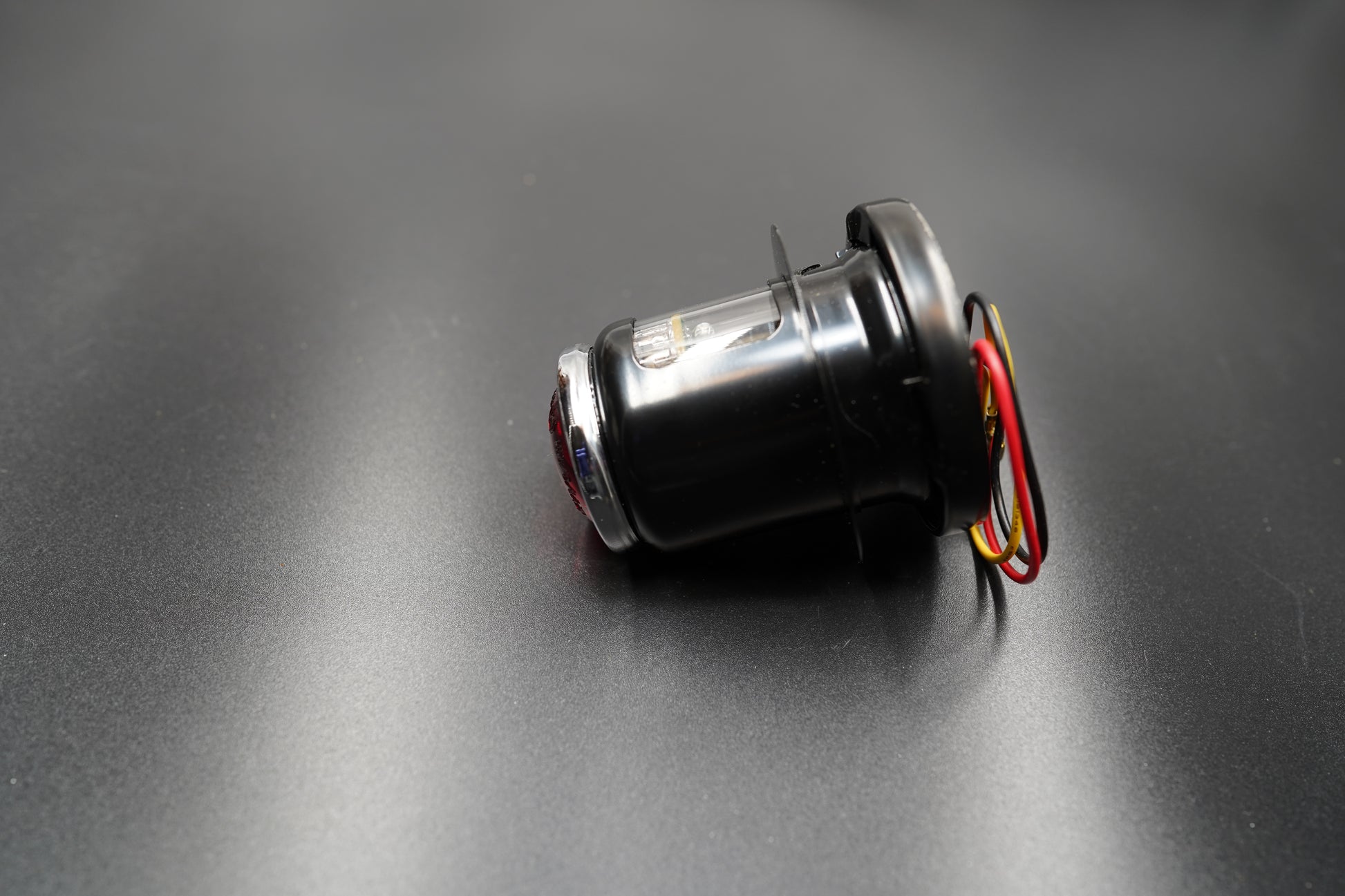 Left side angle showing compact design and 12V wiring layout.