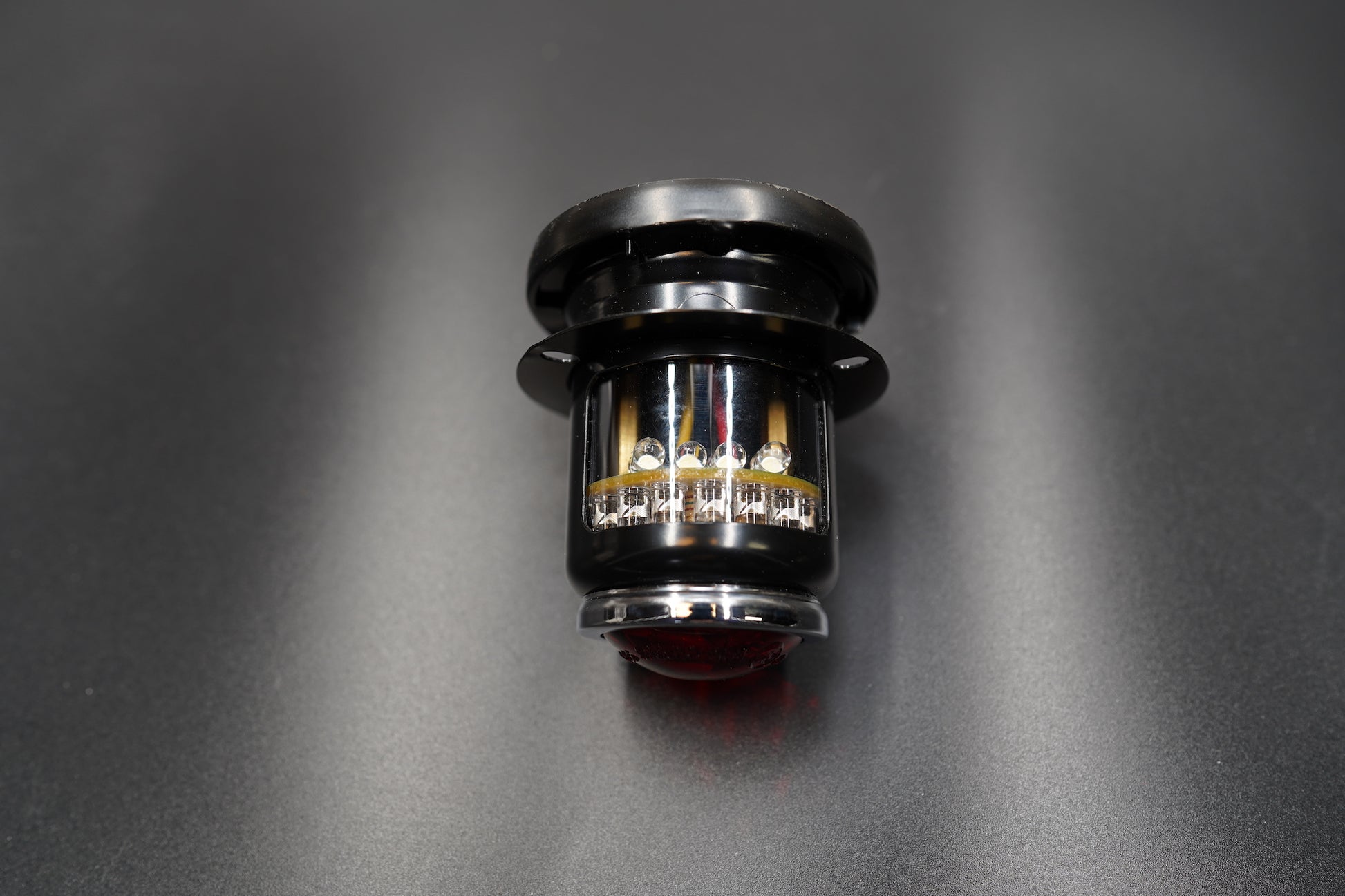 Top-down view highlighting black finish and mounting base.