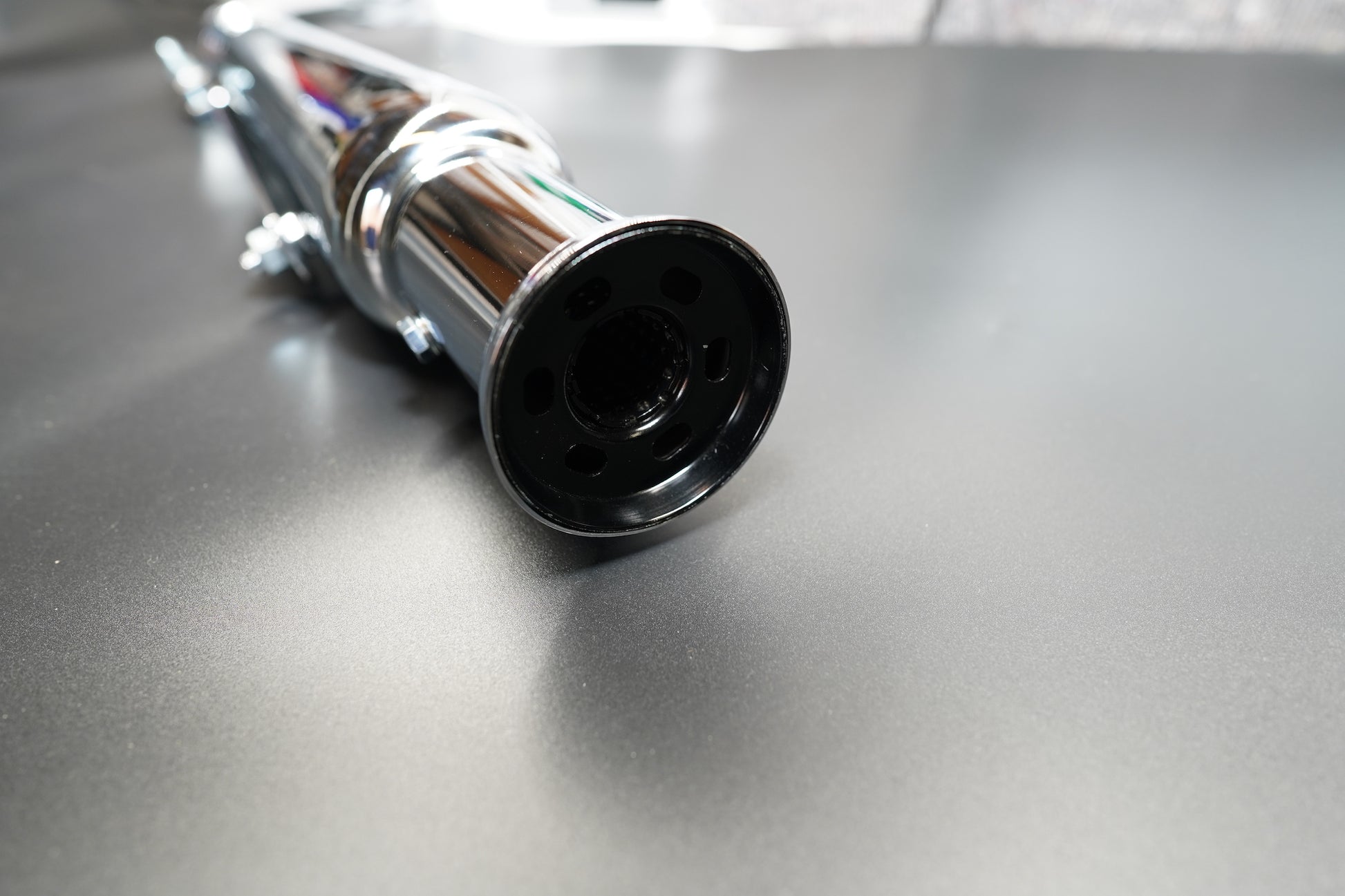  Reducer sleeve and clamp set on flat metallic background. 