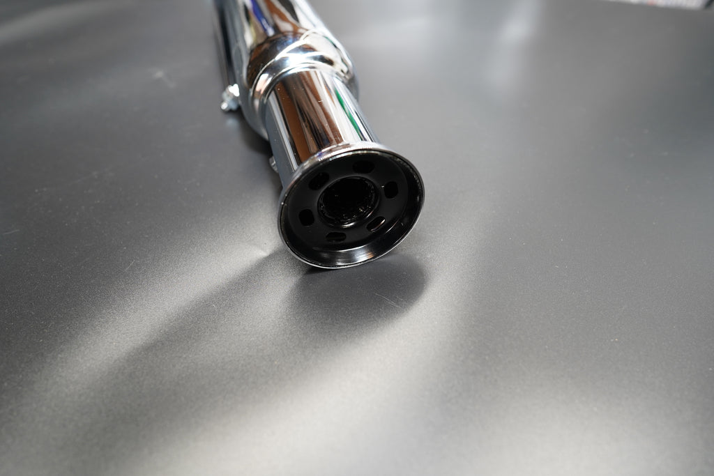 Chrome version surface detail highlighting polish and reflection.