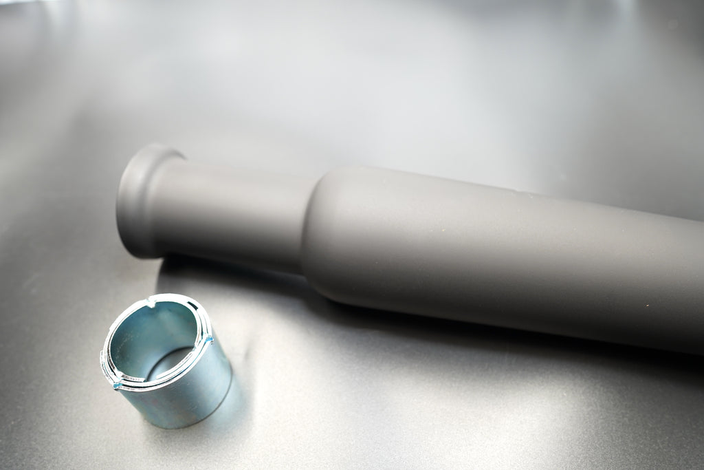 Front angle showing inlet with reducer sleeve next to silencer. 