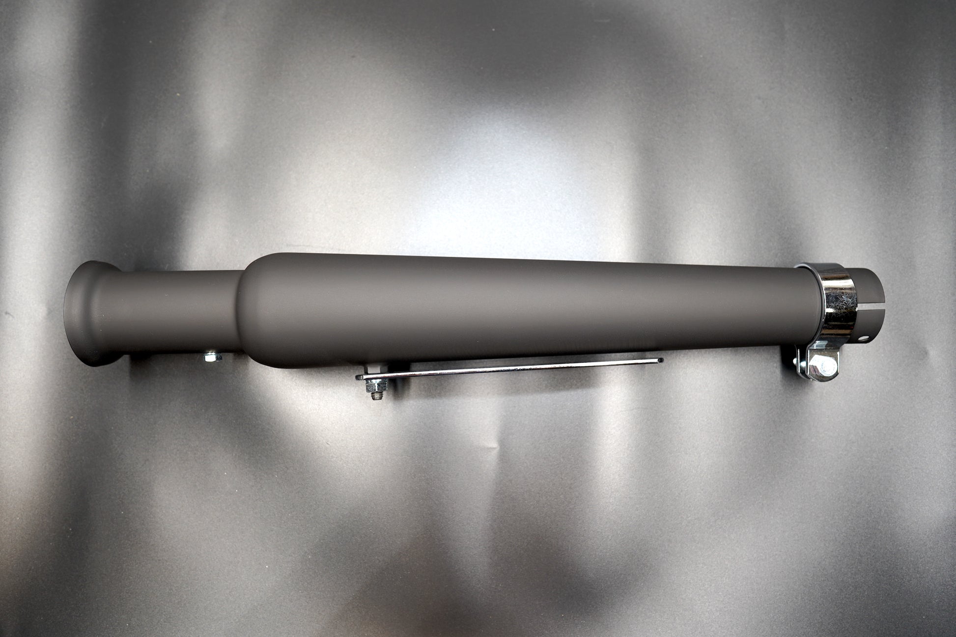 Tapered motorcycle exhaust silencer in matte black finish, side profile view