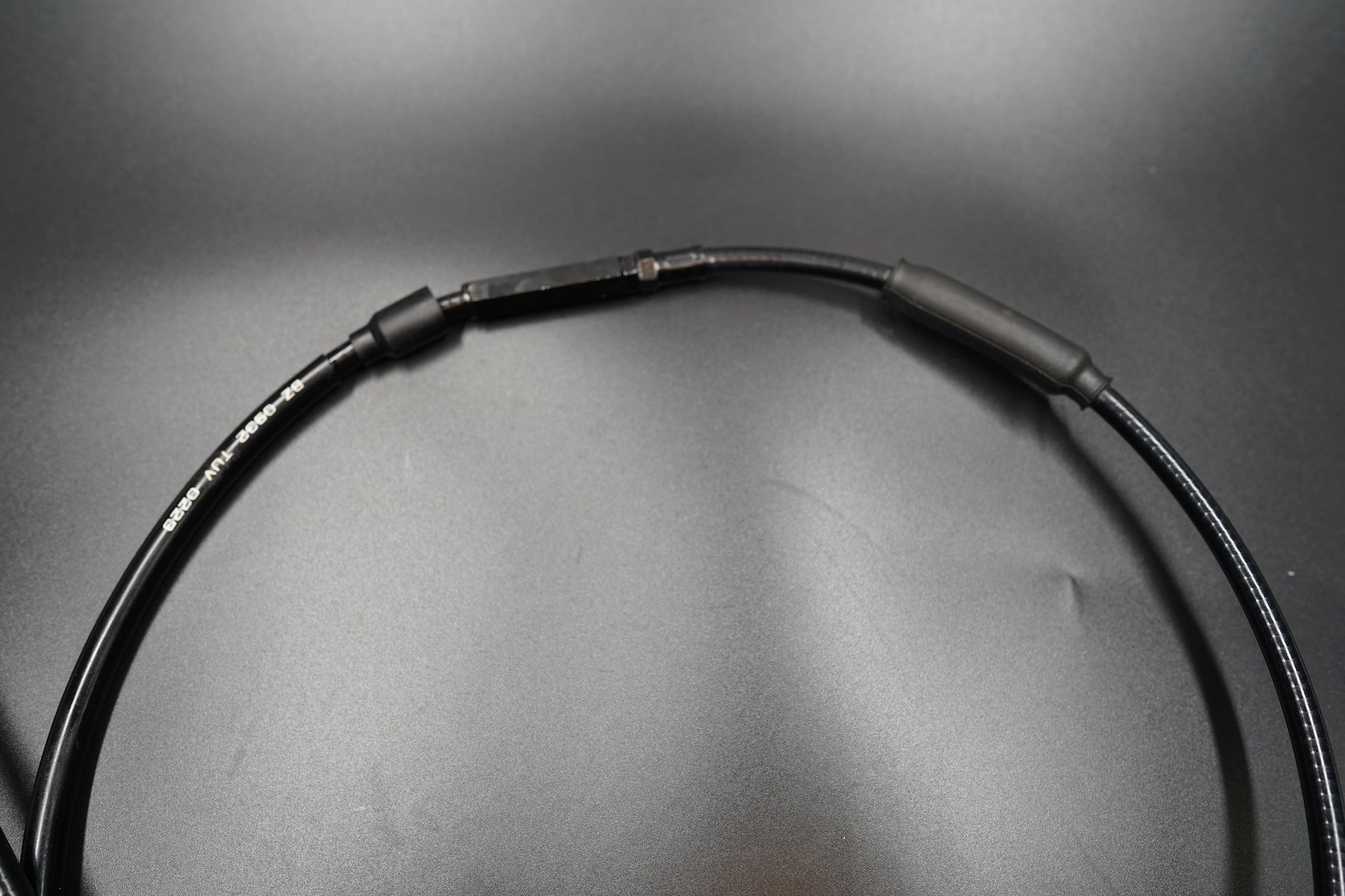 Coiled Triumph Bobber extended clutch cable showing full assembly 