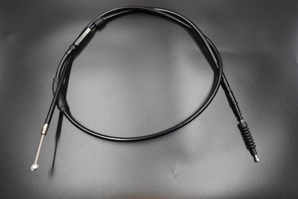 Triumph Bobber extended clutch cable coiled neatly on matte surface 