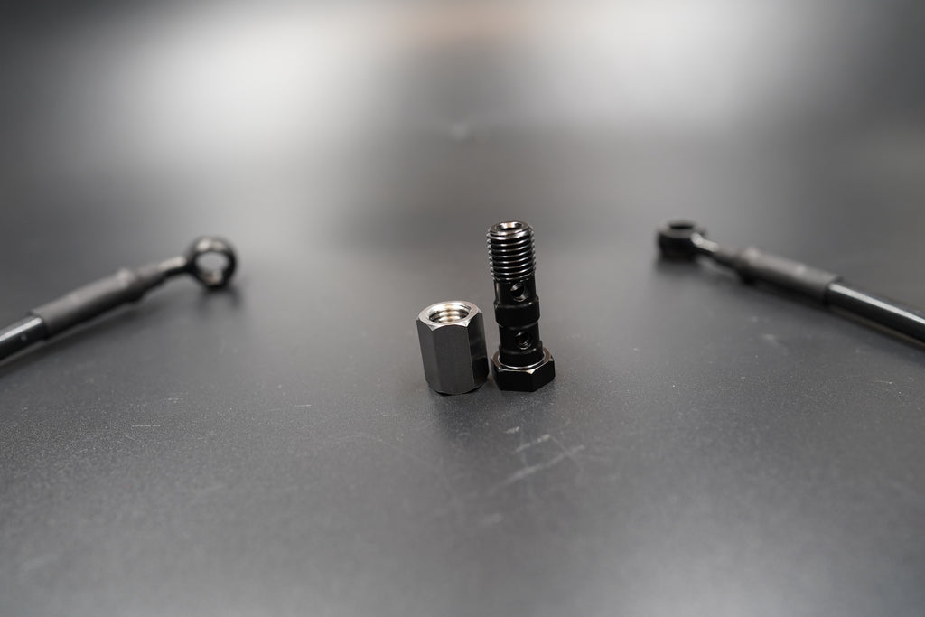 riumph T120/T100 brake cable kit layout with bolts and washers displayed 