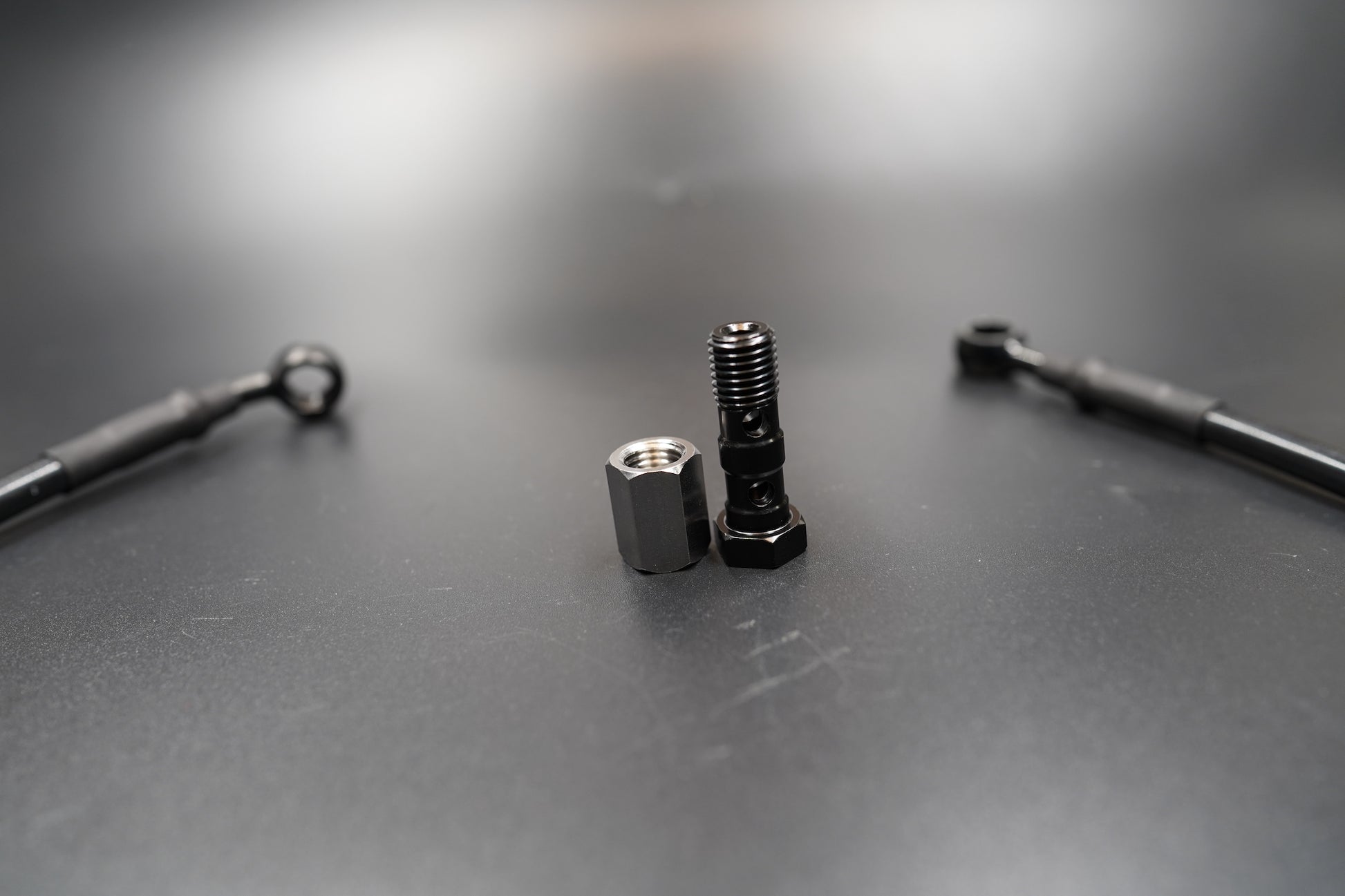 riumph T120/T100 brake cable kit layout with bolts and washers displayed 