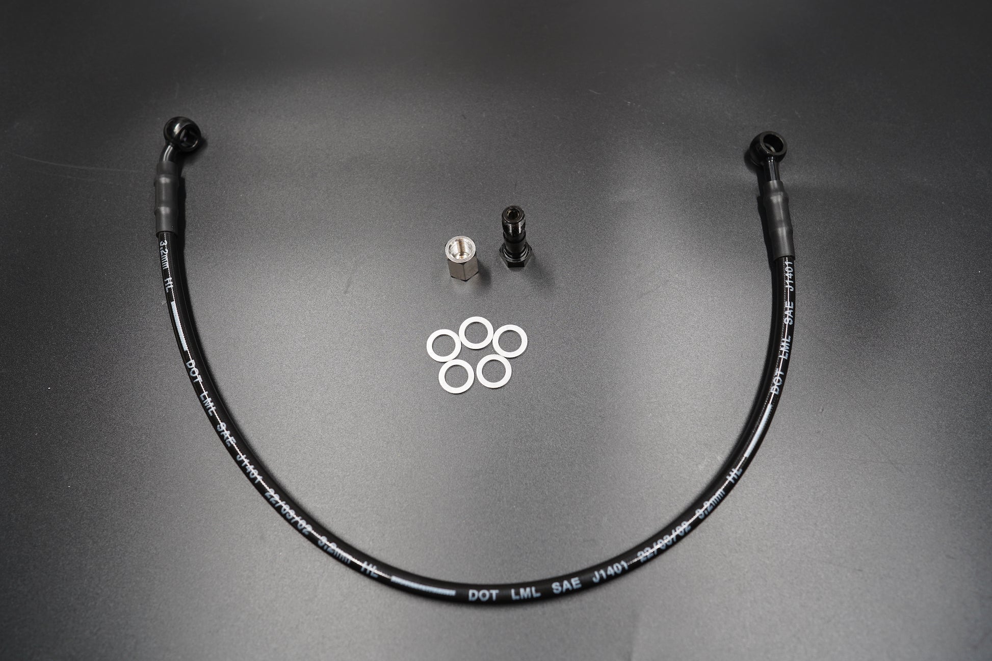 Triumph T120/T100 extended brake cable with fittings and washers on matte background