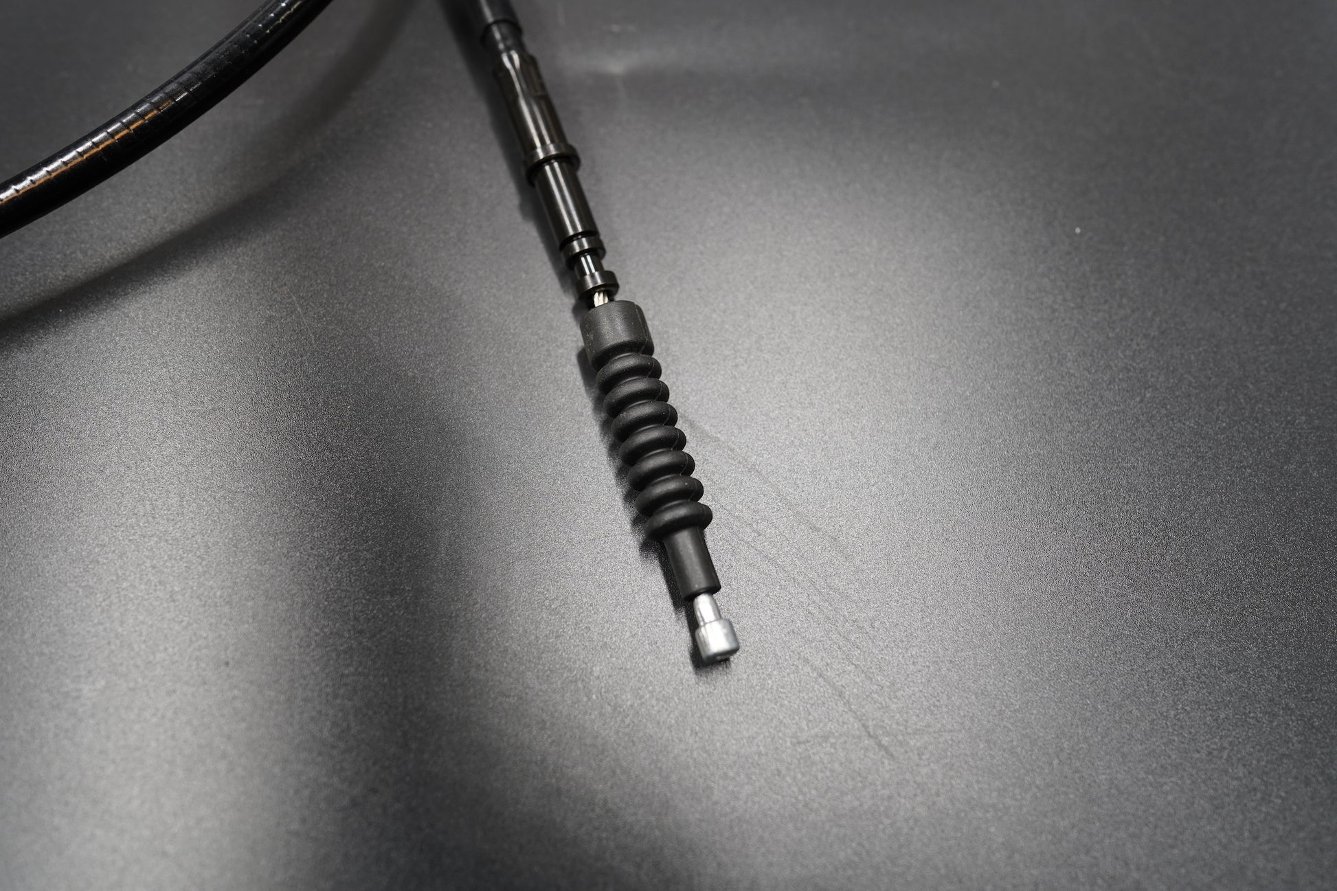 Detailed view of Triumph T120/T100 clutch cable connector and threaded section