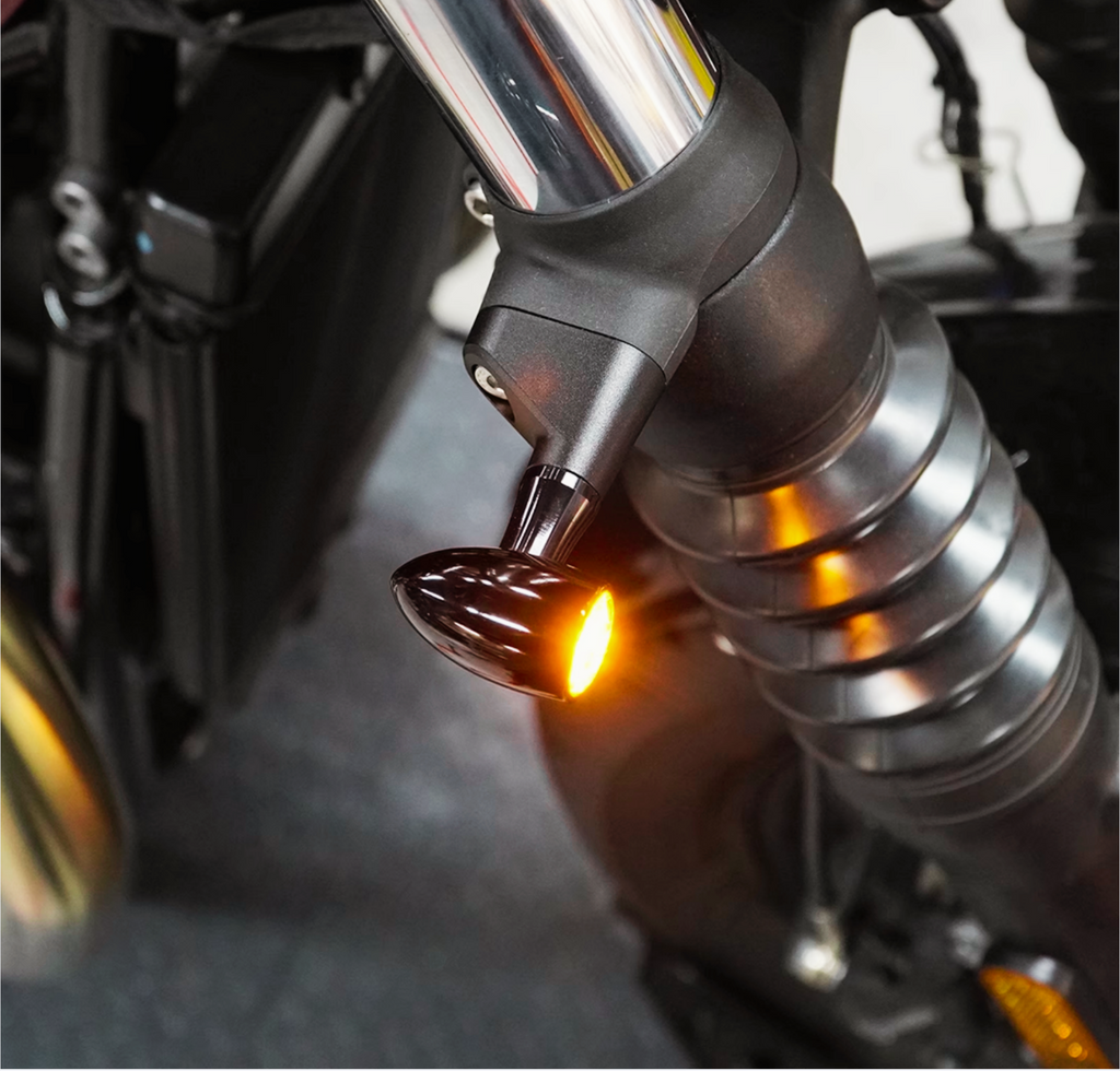 Front perspective of Triumph motorcycle showing aluminum spacer alignment with indicator