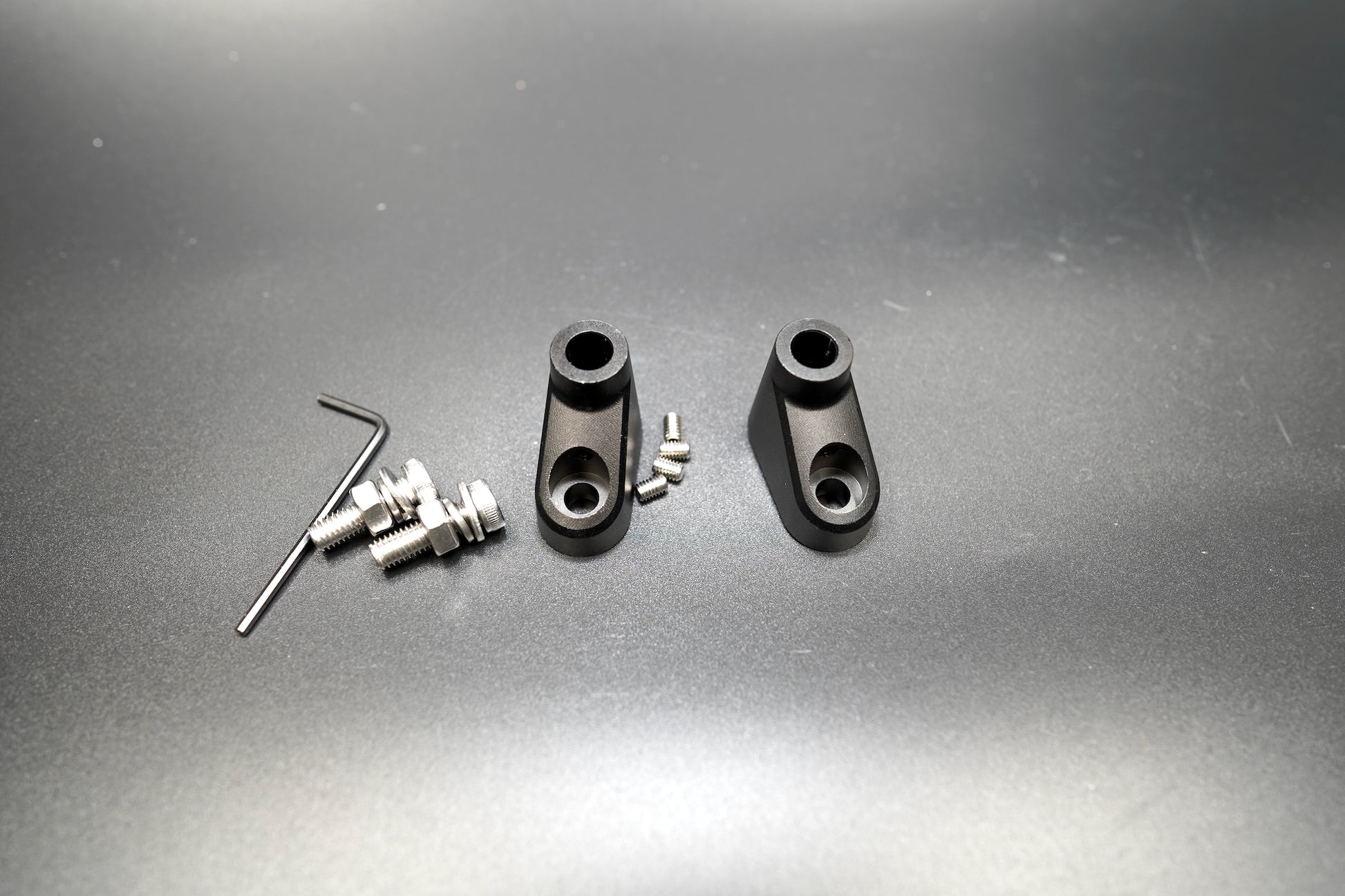 Full spacer kit with bolts and washers laid flat for Triumph classic models