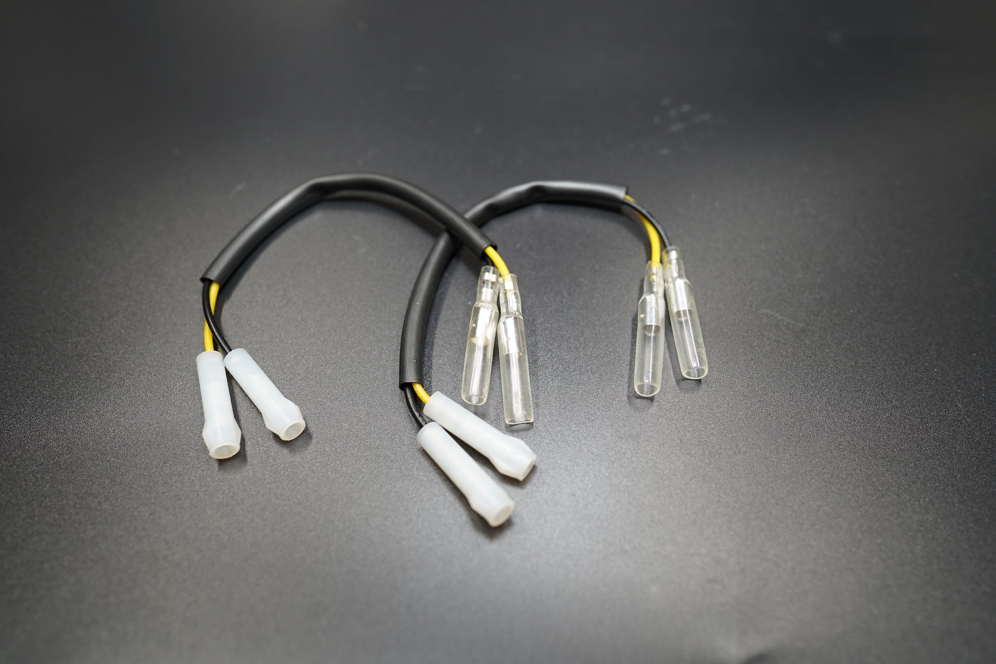 Close-up of Triumph plug and play LED signal connector showing sealed terminals 