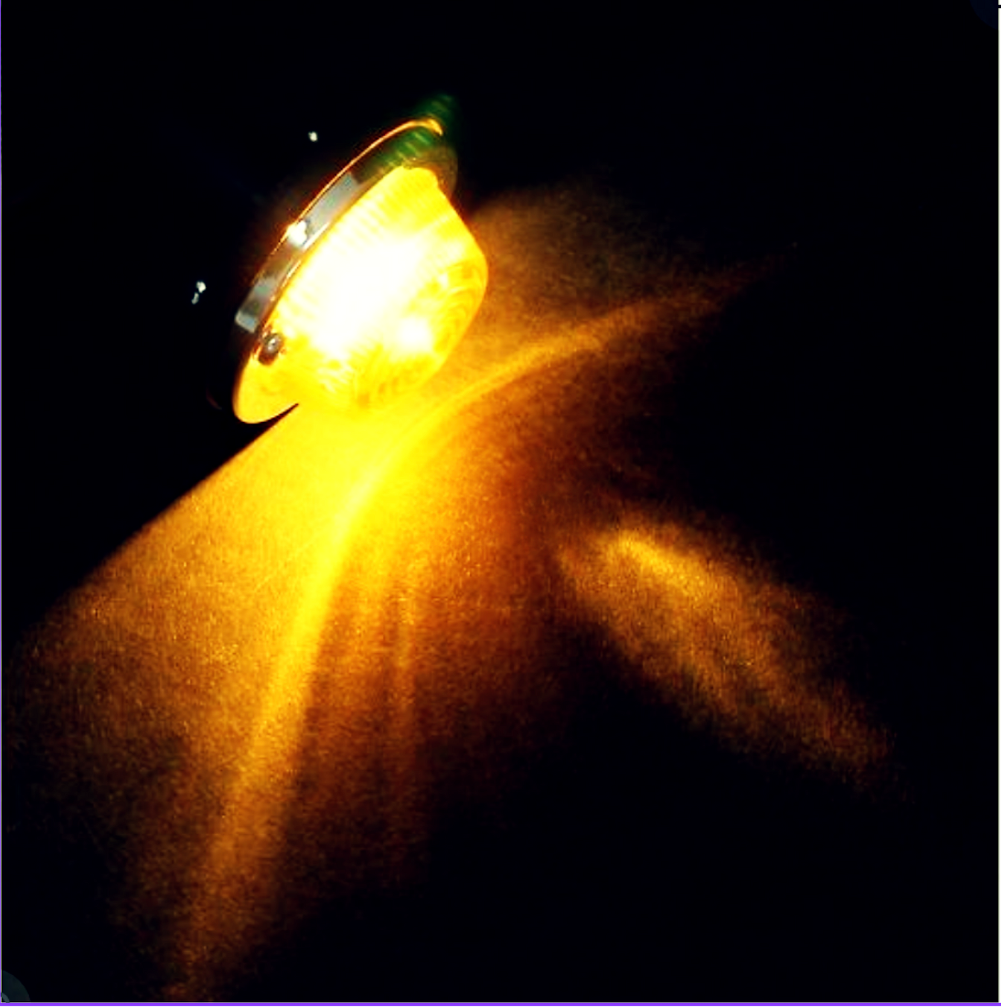 Illuminated amber glow under low light — showcases brightness and visibility of halogen turn signal.