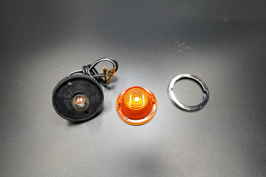 Side view with full set components — signal light, mounting ring, and wiring shown together.