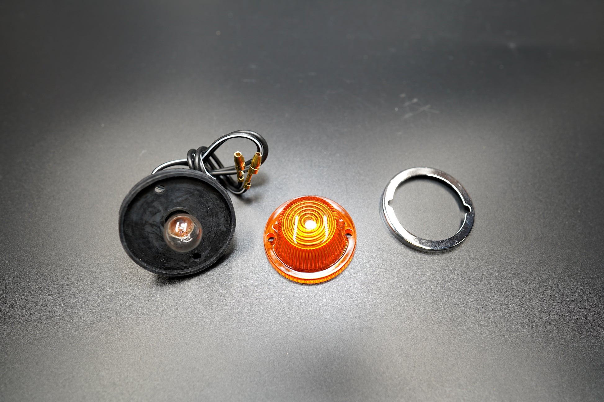 Side view with full set components — signal light, mounting ring, and wiring shown together.