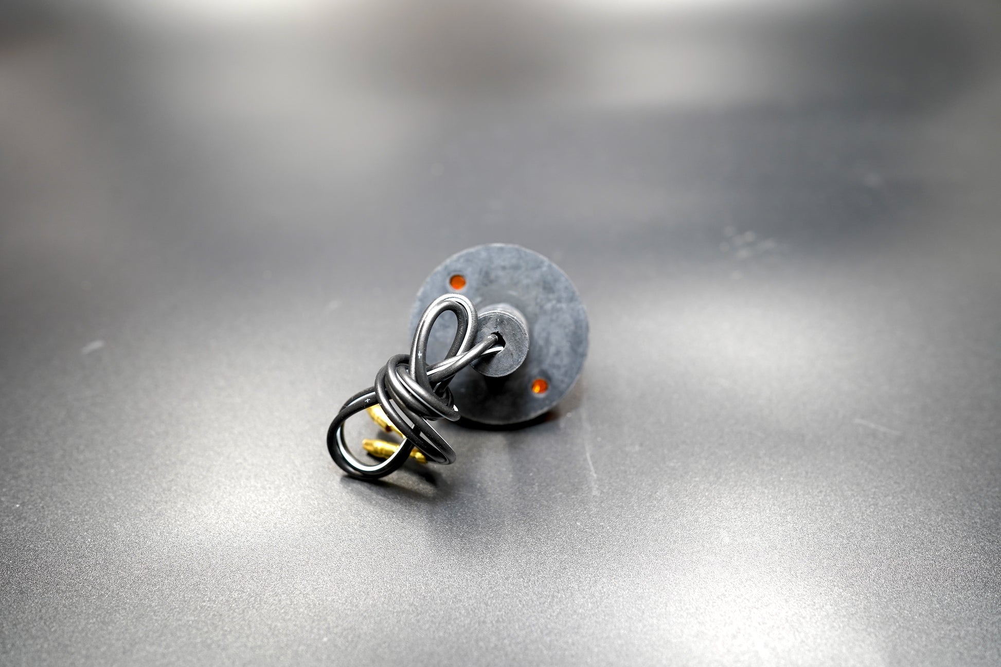 Rear view highlighting wiring detail and sturdy housing — vibration-resistant build for motorcycles.