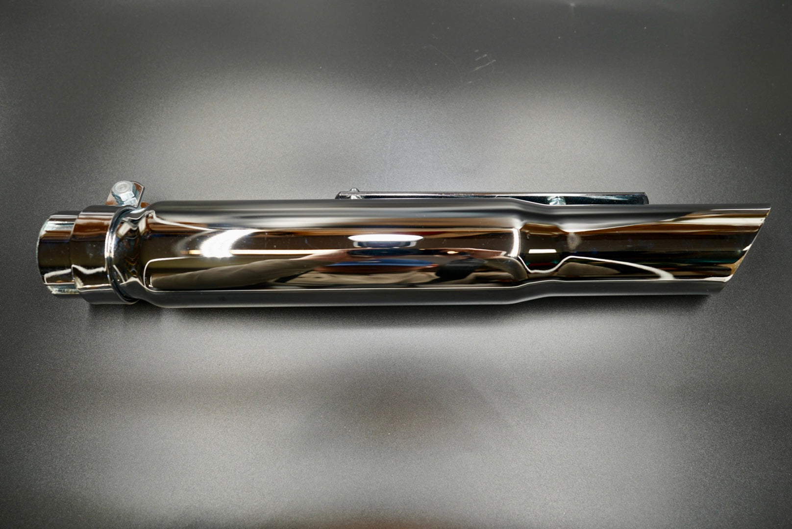 Universal chrome motorcycle exhaust silencer with mounting kit, side profile view