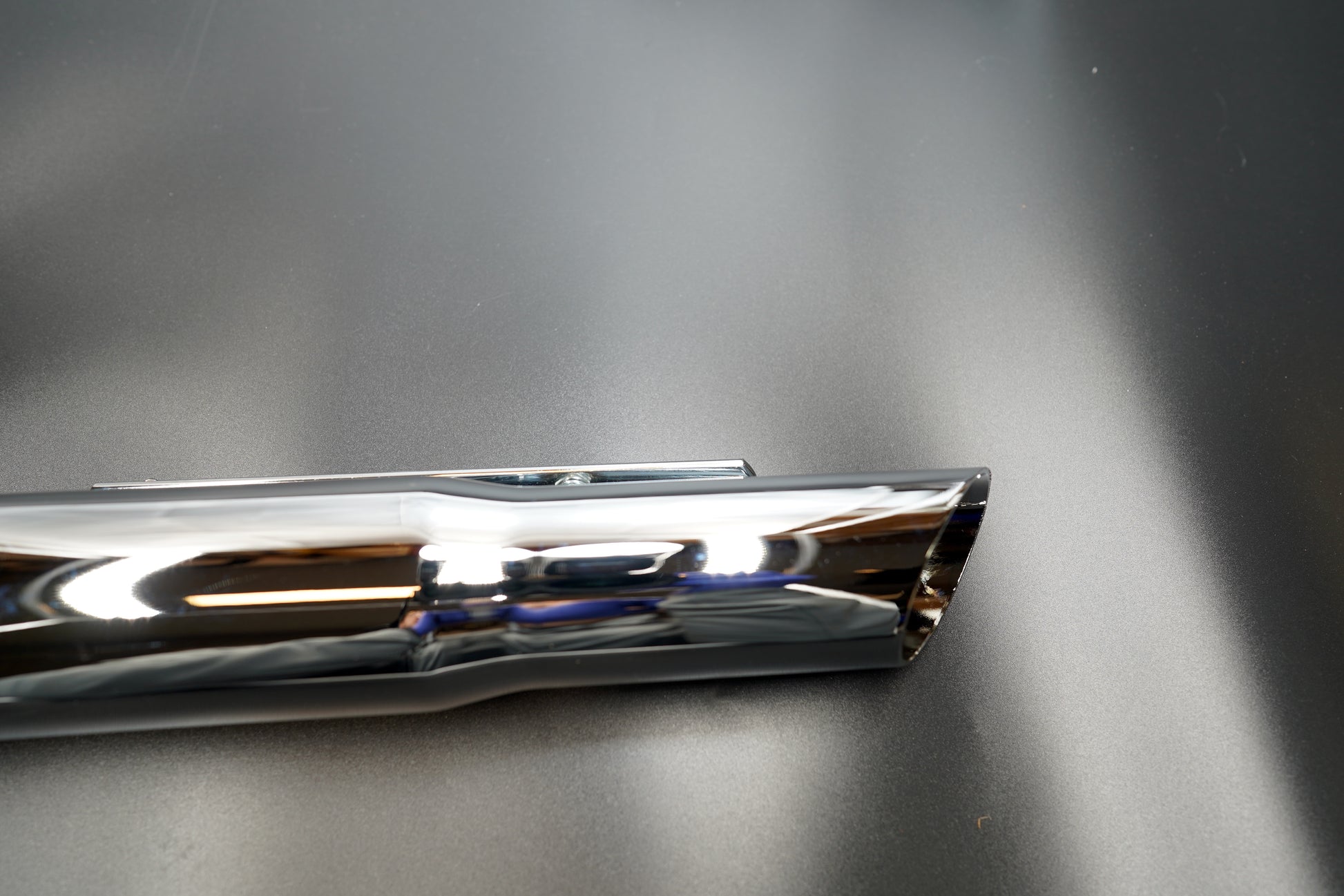 Rear shot showing outlet end and mounting bracket attachment.