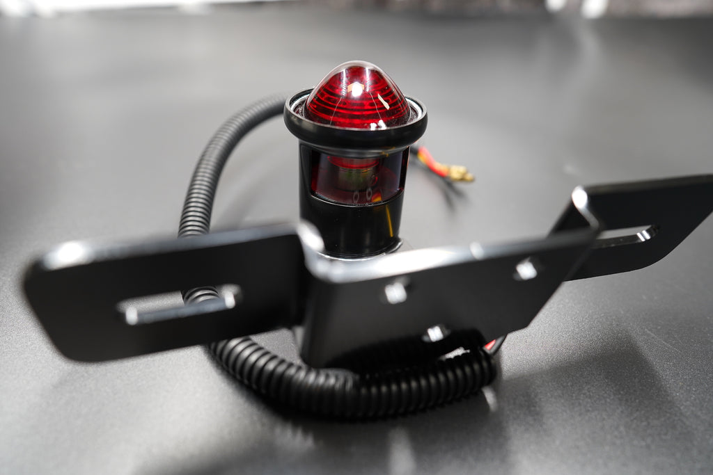 Rear view showing wiring exit and plate mount configuration.